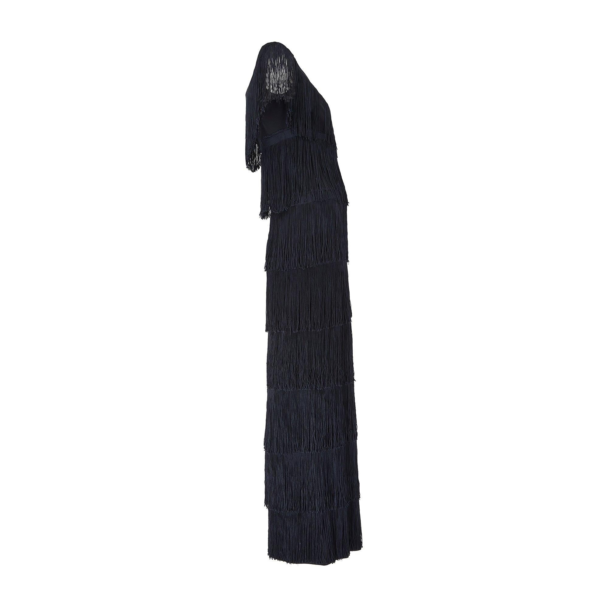 This documented elegant column dress was designed in the early 1970s by Loris Azzaro, whose simple and elegant lines came to epitomise the high end occasion wear of the era. His designs were worn by Marisa Berenson, Jane Birkin (pictured here), Tina