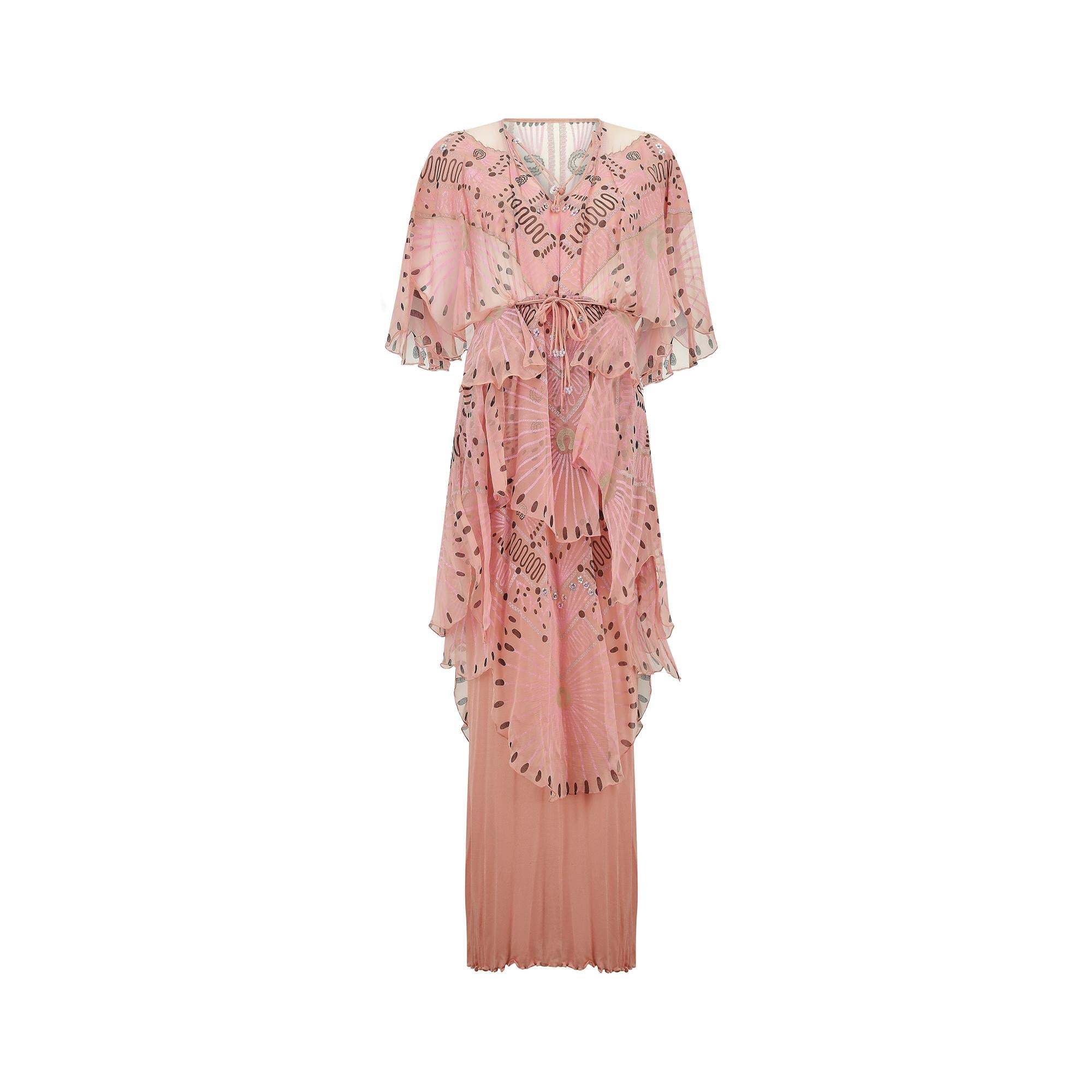 Fine and rare 1976-1978 documented Zandra Rhodes couture 'Mexican Turnaround' printed silk dress. The colourway for this design is pink, brown and pale blue.  The design comprising of a poncho-like tiered top with delicate neck tie feature and silk