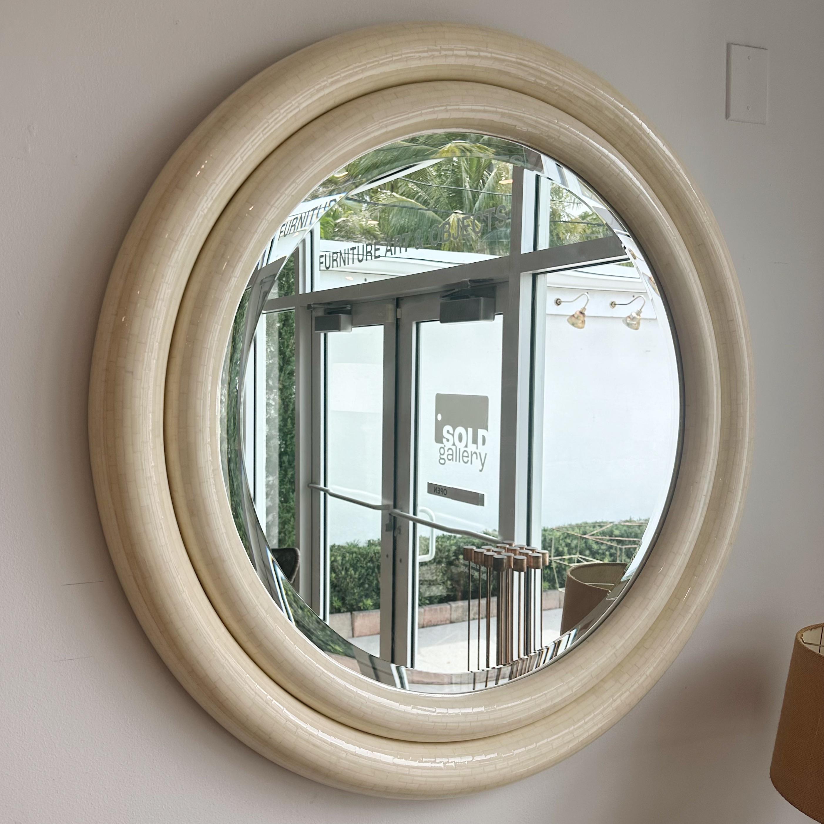 Early 1970s double bullseye wall mirror in tessellated bone with beveled edge mirror. Made in Columbia label on reverse side.
