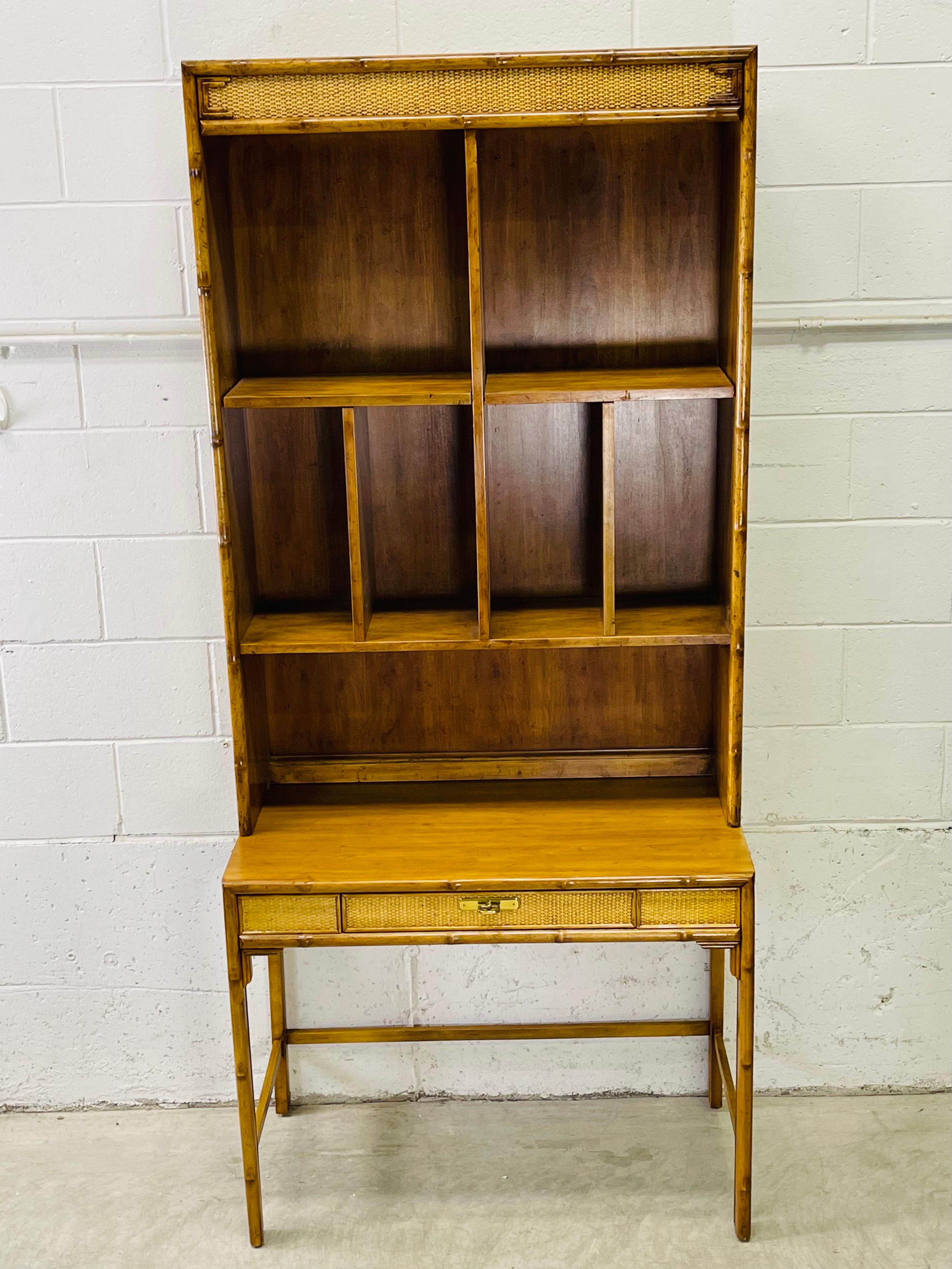 Vintage 1970s Drexel Furniture bamboo and cane accented tall two part secretary desk. The top part has shelving and the base has a writing area with a single drawer for storage. This desk is from the Captiva collection. The shelves are 10”deep.