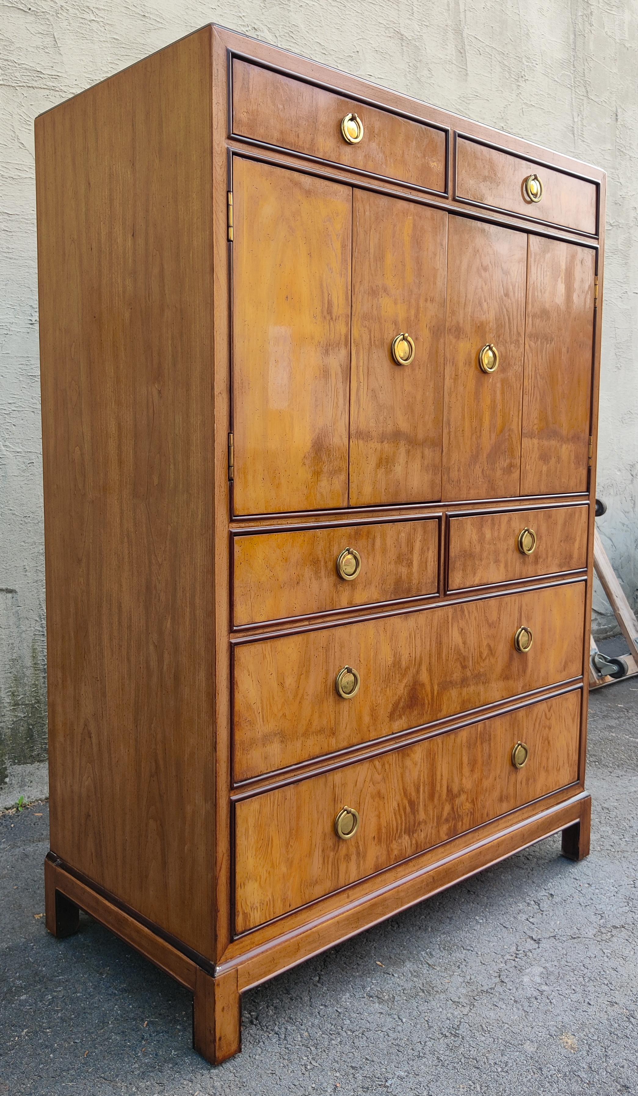 This beautiful gentleman's chest or tall dresser was made in the 1970s by Drexel Heritage for their 