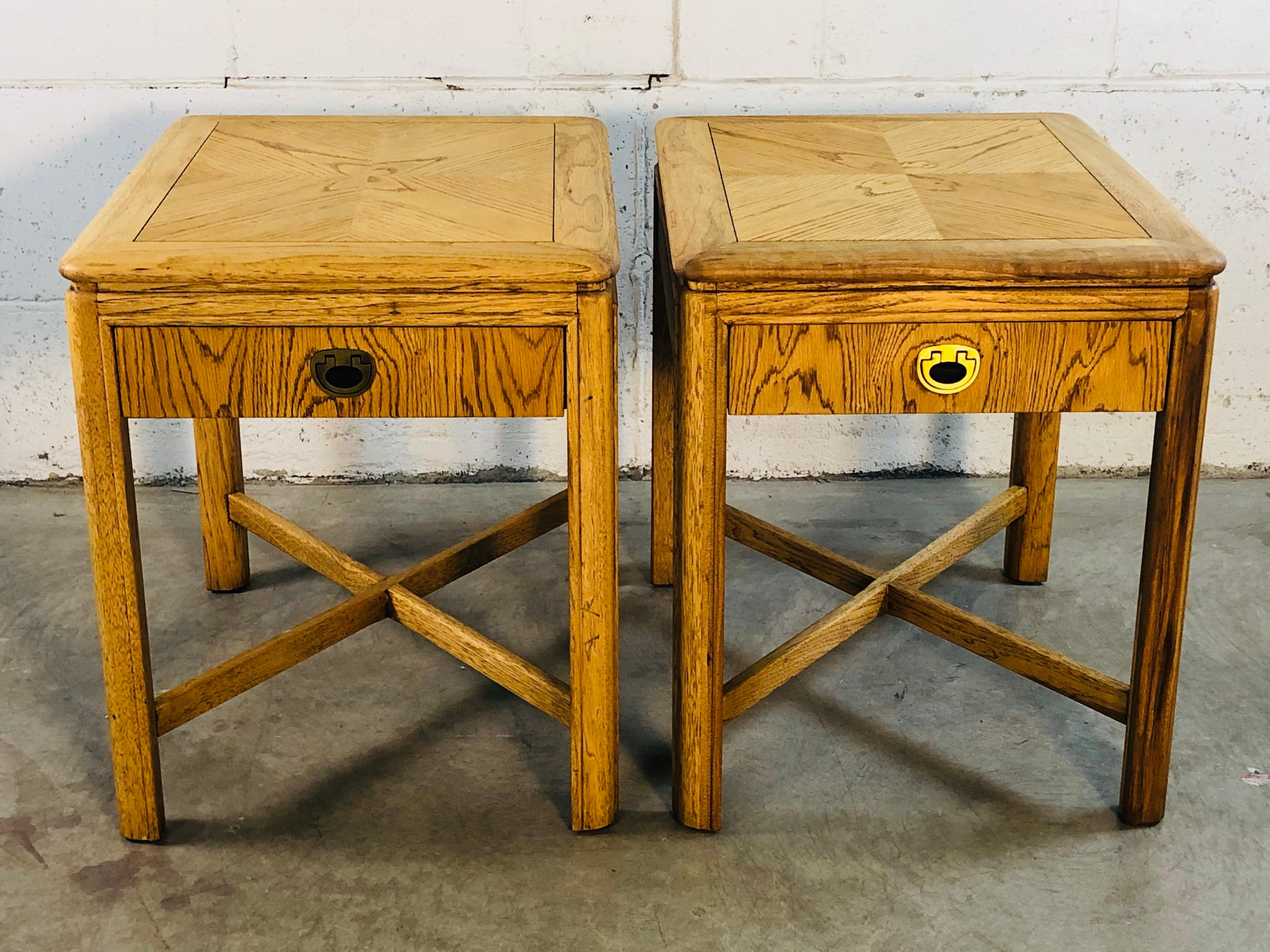 Vintage 1970s pair of wood side tables by Drexel Furniture from the Passage line. Both tables have a single drawer for storage that is marked. Both tables have been refinished and restored to show the beautiful wood grain on top. Marked and in