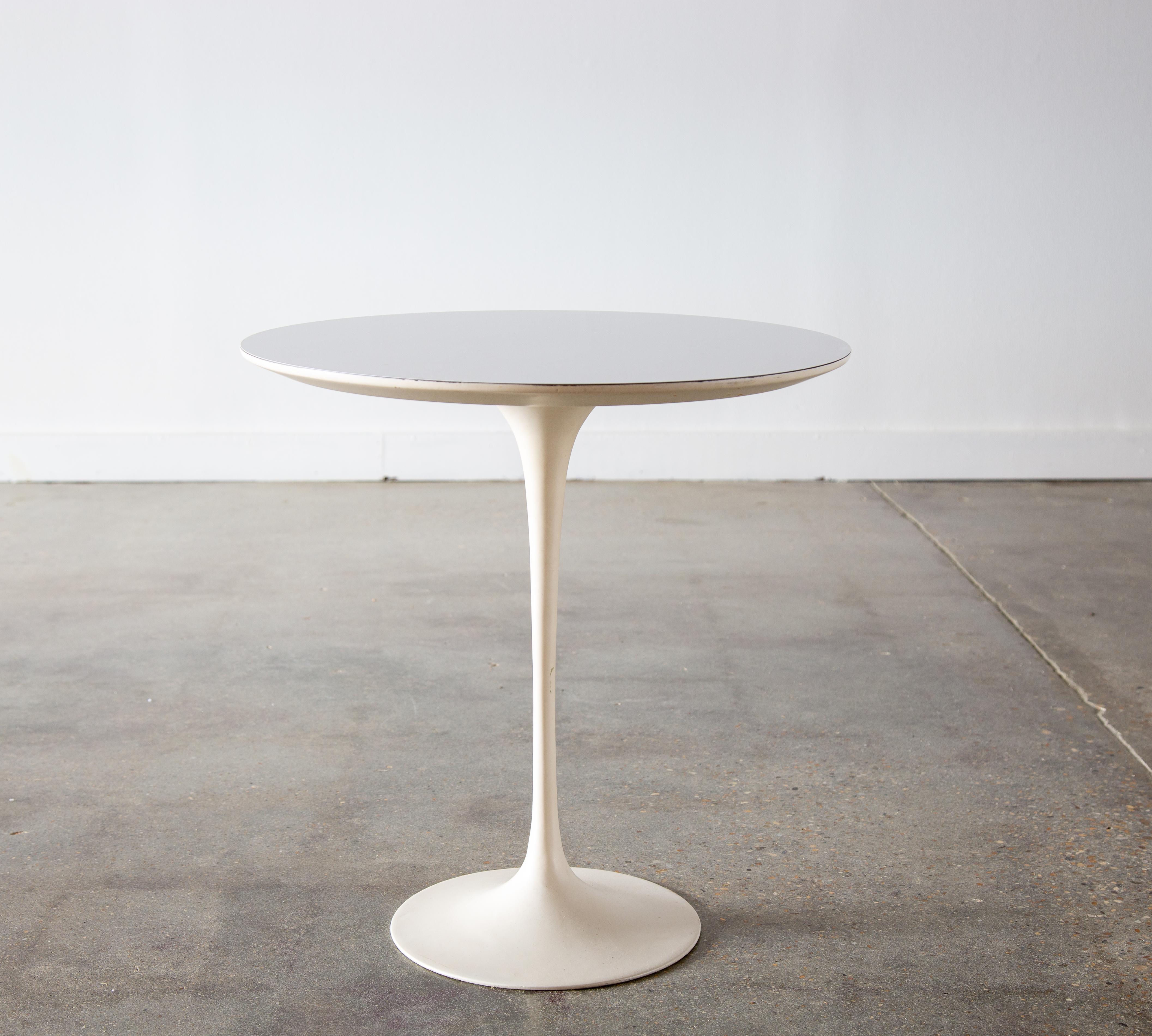 A 1970s 20” white laminate top tulip table designed by Eero Saarinen for Knoll International.  This example retains its original label. Weighted base. A true classic. 

Dimensions:

20” High x 20” Diameter

Condition: 

Very good vintage condition.