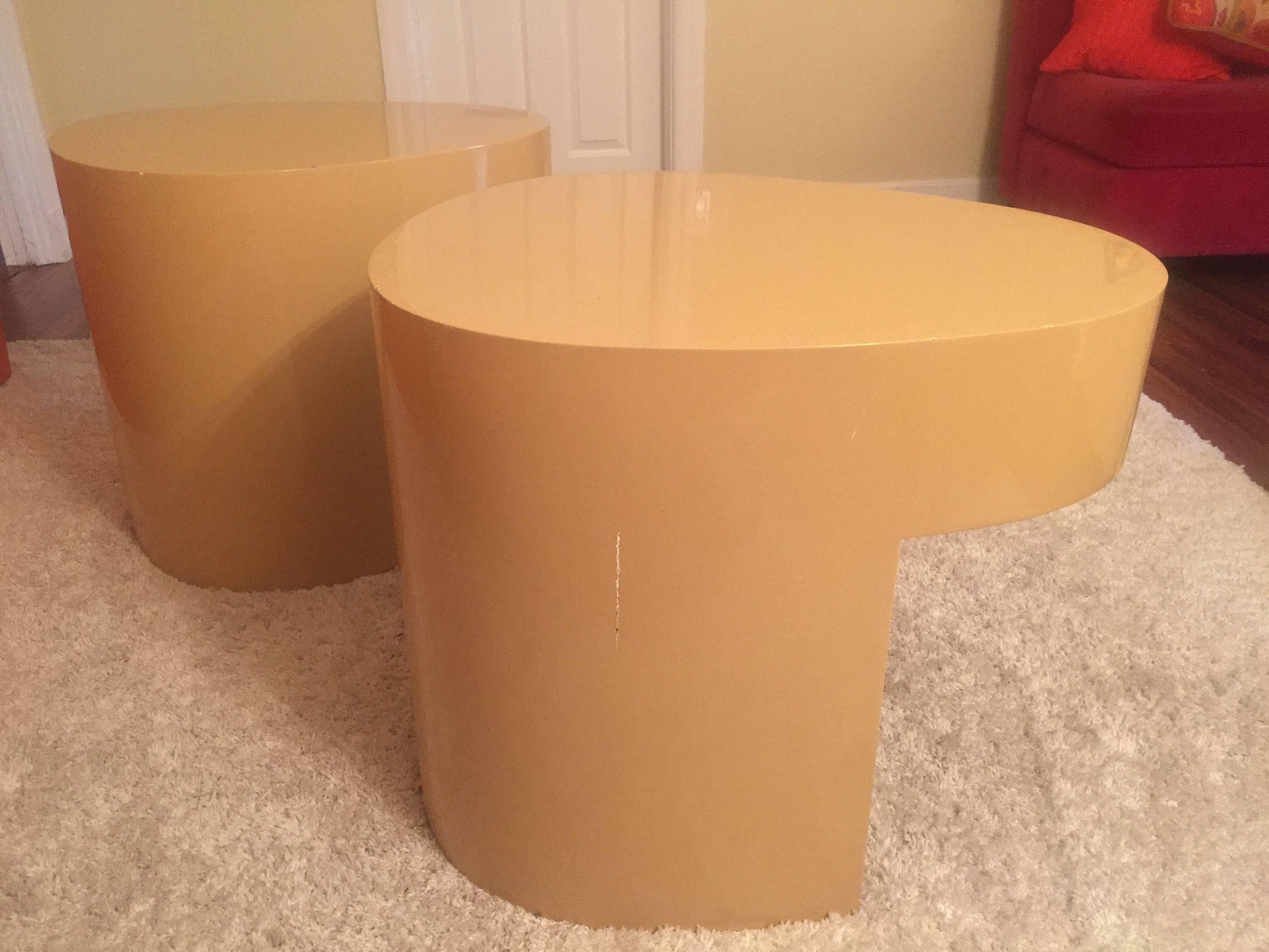 Unusual pair of cream colored side tables or nightstands 