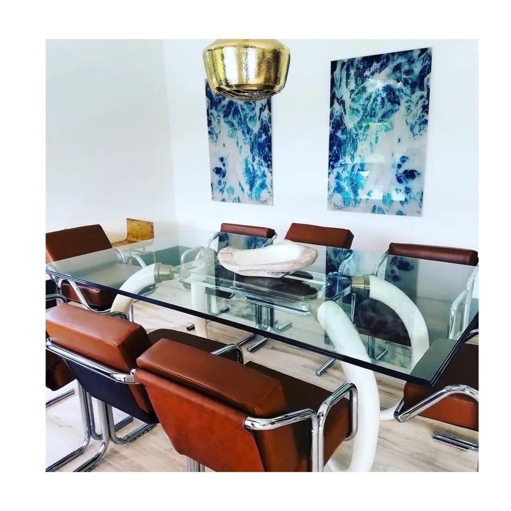 We are very pleased to offer a stunning dining table attributed to Suzanne Dahl & Jerry Barich, circa the 1970s. Tusk-shaped legs, lucite, brass, and glass, all exquisitely combined in an everyday dining table that's anything but ordinary. Beautiful