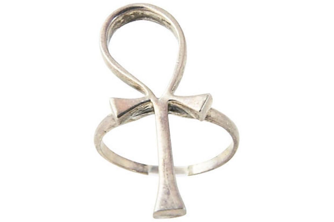 Elongated sterling silver ankh ring, circa 1970. Marked: Sterling. US size: 10 3/4; can be sized. Age wear.
