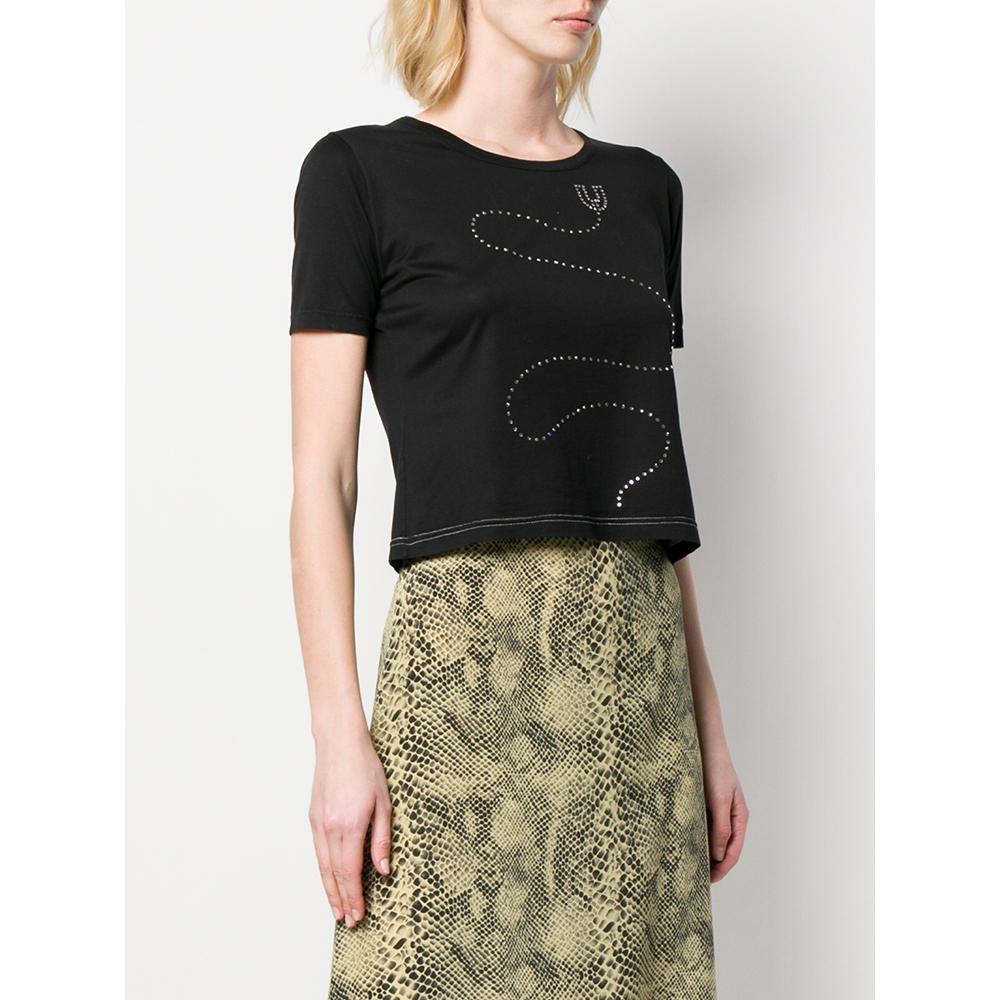 Emanuel Ungaro black cotton t-shirt, crew neck, short sleeves and front decorative detail with applications.

Years: 70s

Made in Francia

Size: S

Linear measures

Bust: 48 cm
Shoulders: 40 cm
