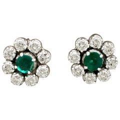 1970s Emerald and 1.45 Carat Diamond White Gold Cluster Earrings