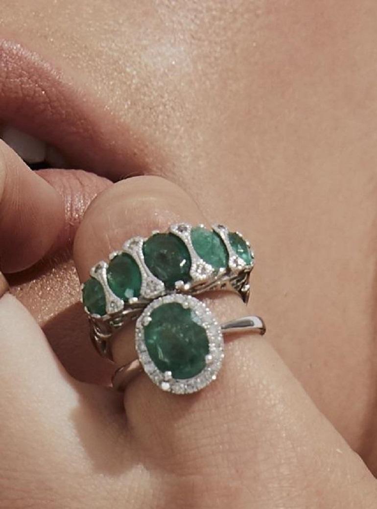 Retro 1970s Emerald and Diamond Halo Ring White Gold For Sale