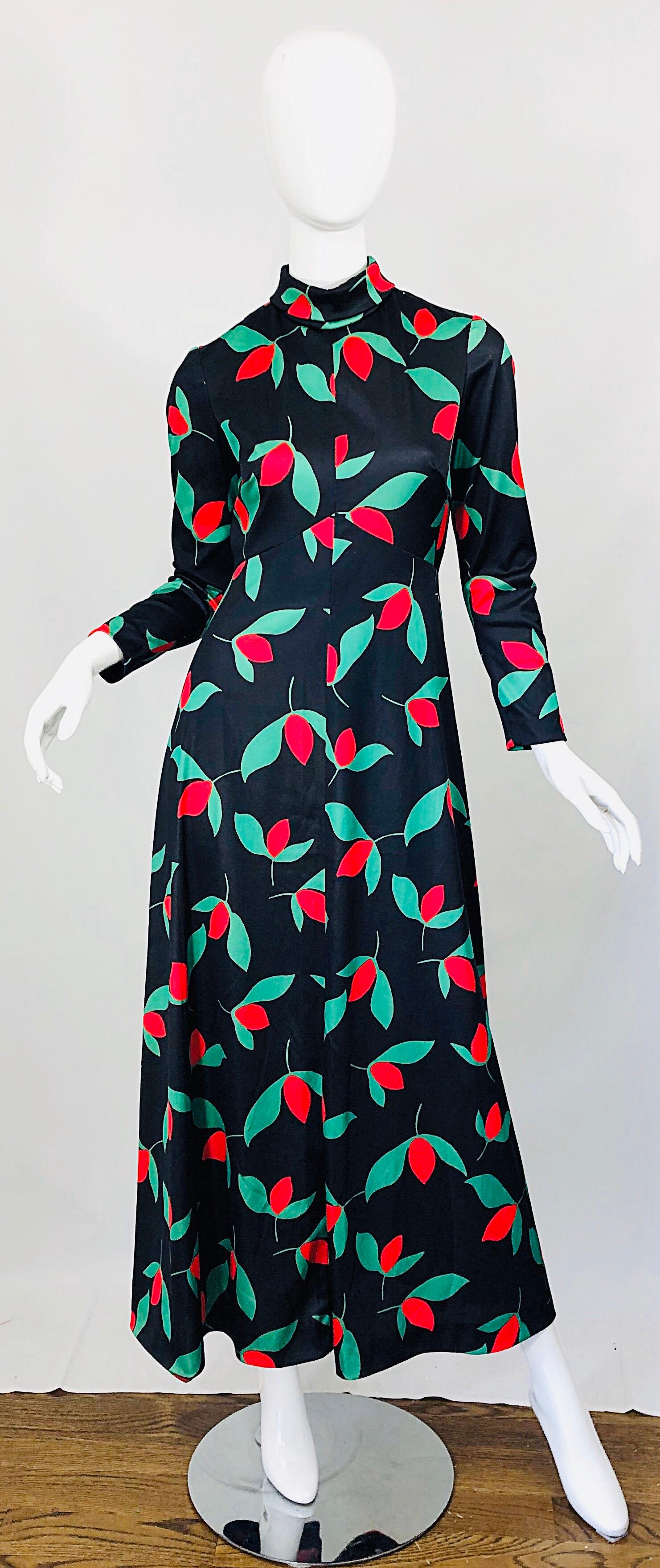 Beautiful and rare vintage 1970s EMILIO BORGHESE black, red and green tulip print long sleeve maxi dress ! Features a sleek tailored bodice with a flattering high neck. Forgiving skirt can fit an array of hip sizes. Hidden zipper up the back with