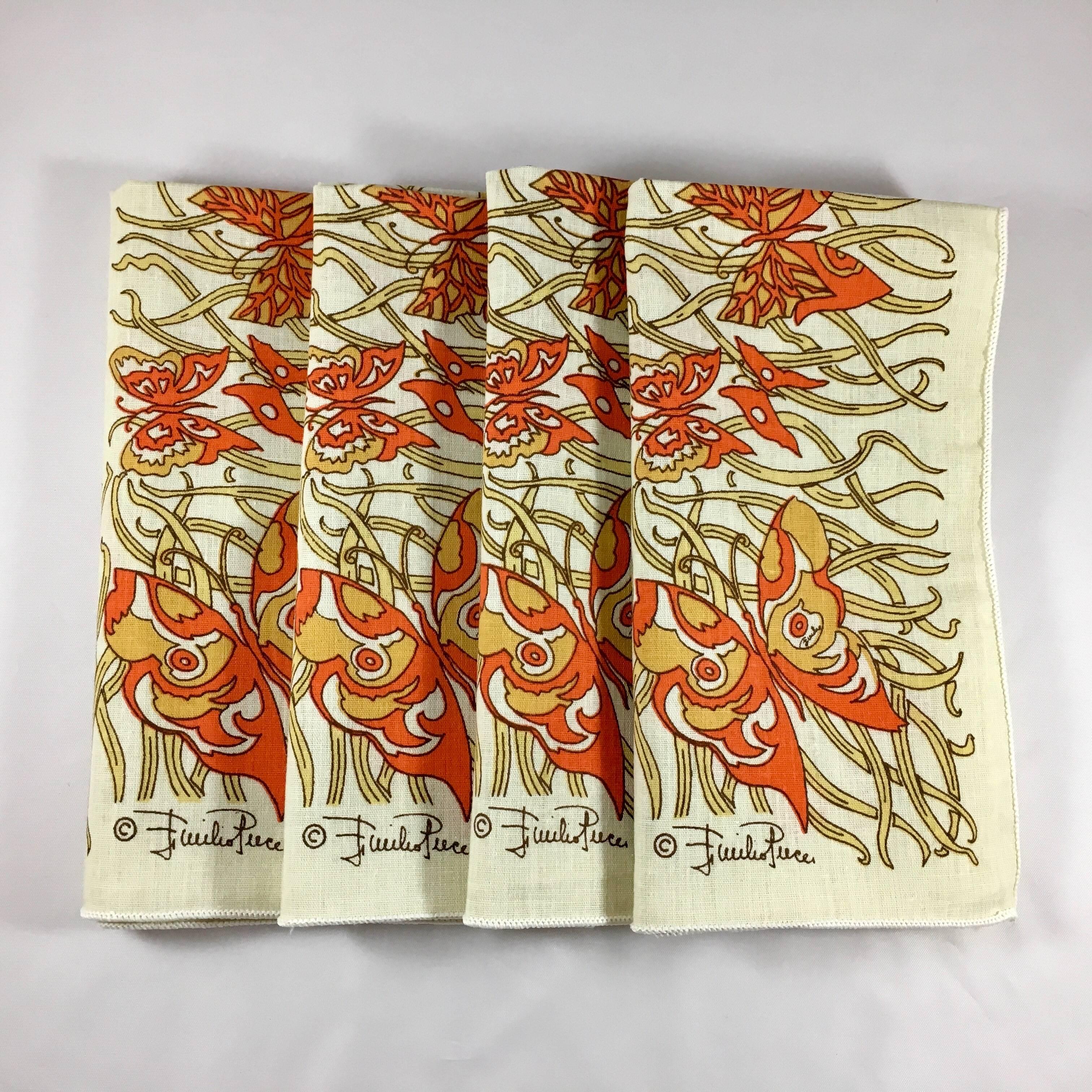 This is a set of four 1970s Emilio Pucci cotton blend napkins with a pattern featuring a beige background with yellow and orange butterflies frolicking through a grass border. They measure 16 3/4 inches x 16 1/2 inches and are in excellent