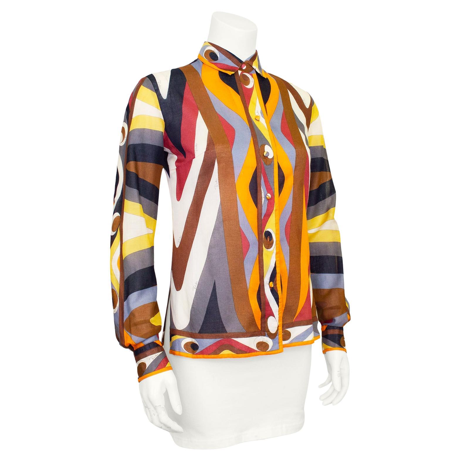 Beautiful Emilio Pucci shirt from the 1970s. Fine cotton in the iconic Pucci abstract geometric print in deep rich tones of orange, grey, yellow and black. Great option for the summer months as the light cotton is great for the heat. Slightly sheer.