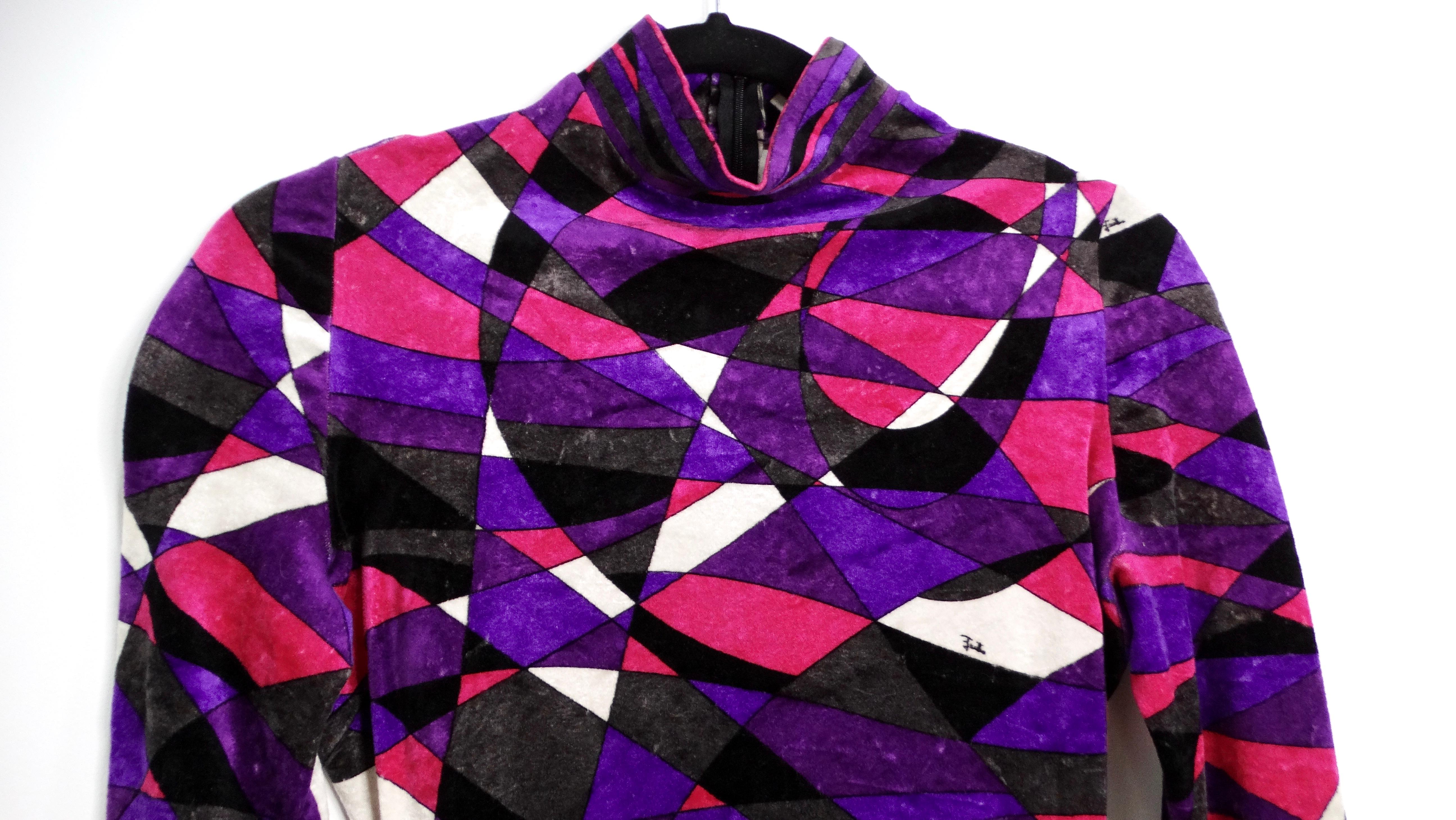 Step into a time capsule of groovy glamour with this authentic vintage Emilio Pucci catsuit, a stunning testament to 1970s high fashion. Drenched in a vibrant purple hue, the velour fabric exudes a luxurious softness and depth, perfectly