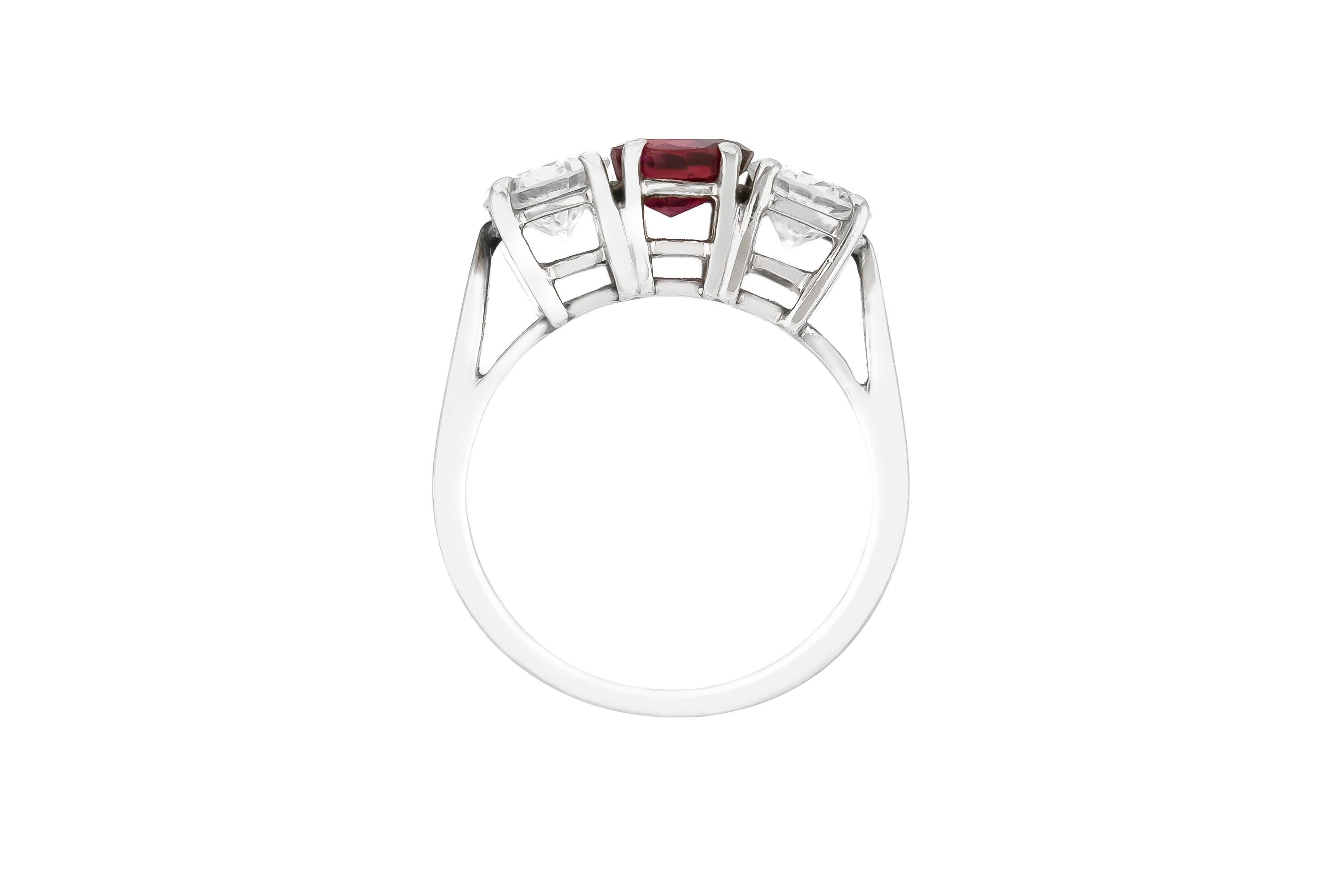 The ring is finely crafted in 14k white gold with center ruby weighing approximately total of 0.90 carat and two side diamonds weighing approximately total of 1.60 carat.
Circa 1970.