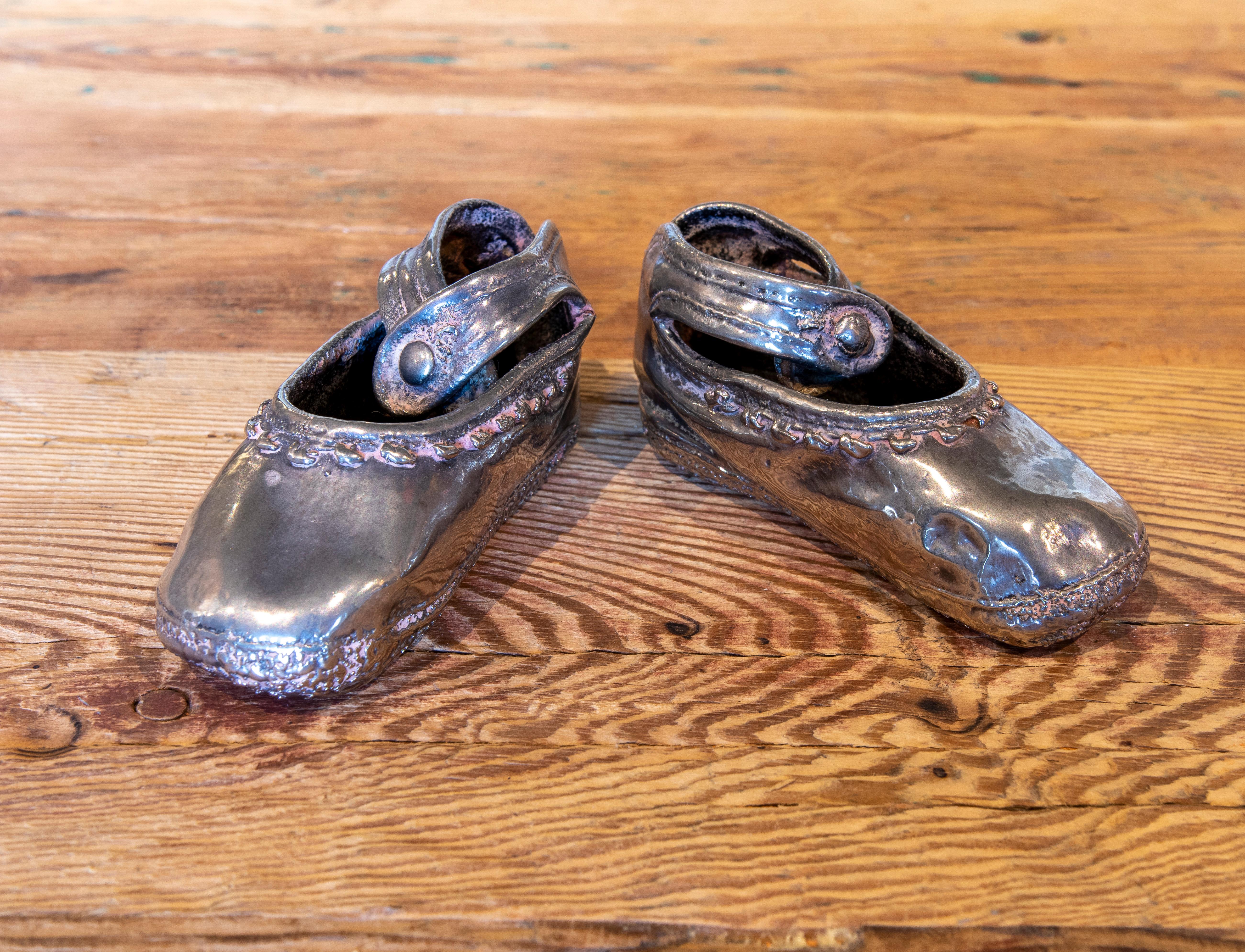 1970s English pair of silver plated metal shoes.