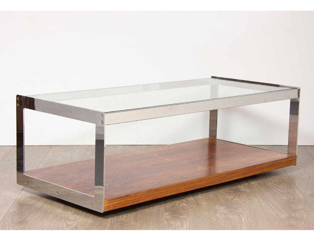 Mid-Century Modern 1970s Merrow Associates chrome and glass coffee table designed by Richard Young. Made in England. The heavy plate glass top sits inside the flat chrome polished frame. A feature Rosewood base shelf, with beautiful grain, sits on