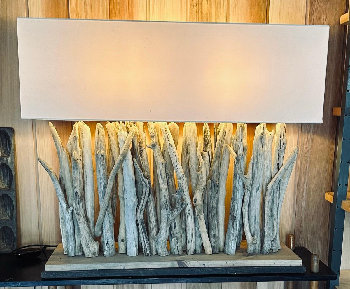 A large and rather impressive vintage rustic driftwood rectangular table lamp.  Made in England.  This double lightbulb table lamp is well made with vertical pieces of gnarly twists of driftwood which have a natural well-worn aged patina to them. 