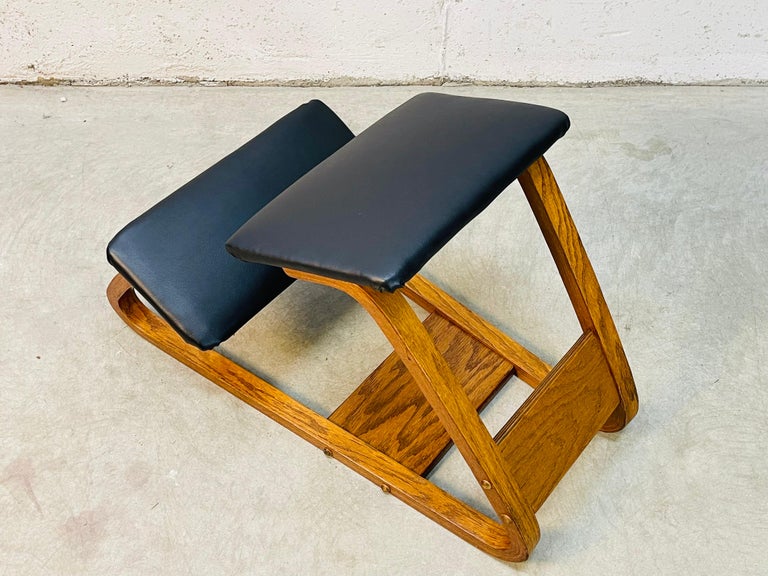 Vintage 1970s ergonomic kneeling office bentwood chair. The chair is made of oak wood and new vinyl seating. The chair is sturdy with no marks.