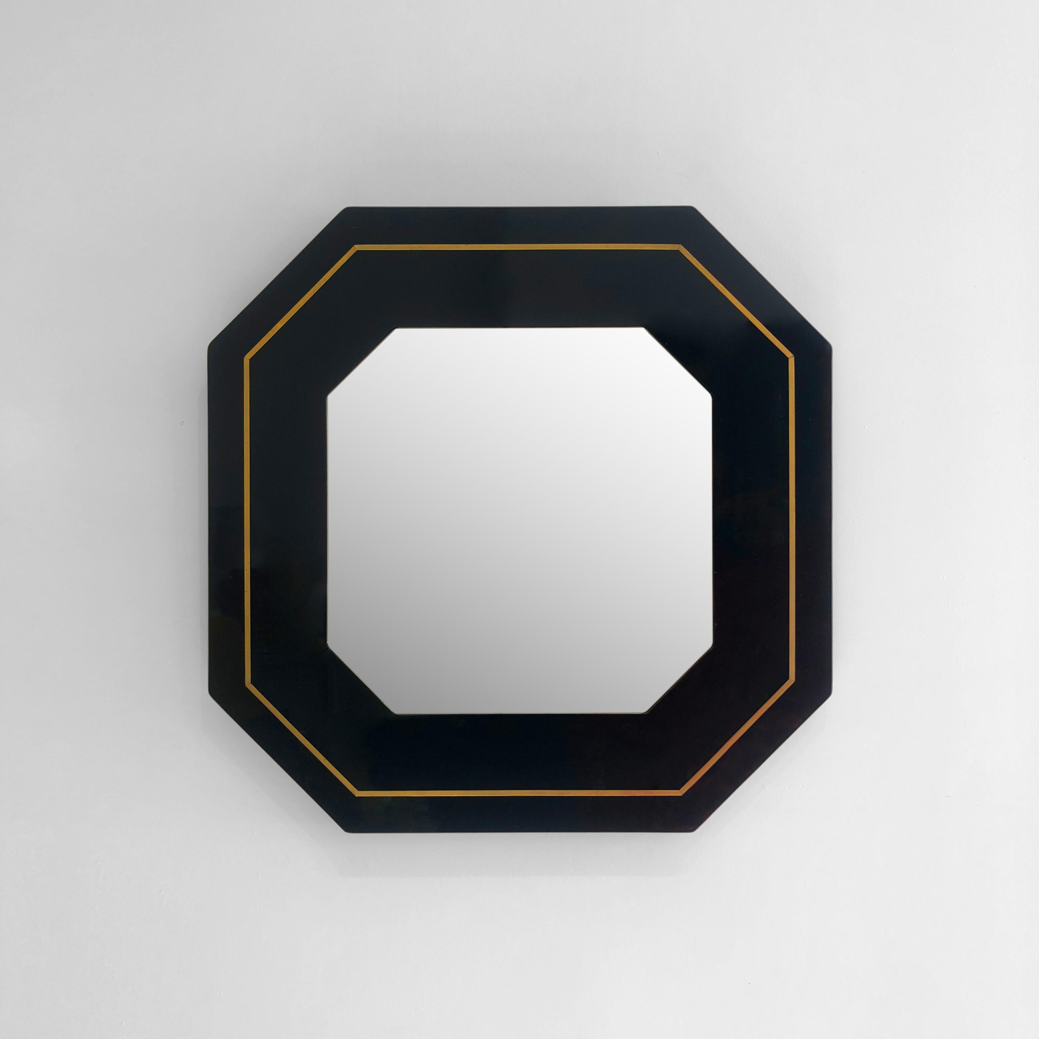 The octagonal wall mirror designed by Eric Maville in the 1970s that beautifully combines modern materials and design aesthetics of that era but still keeps its contemporary look. The mirror's shape, an octagon, adds a touch of uniqueness and