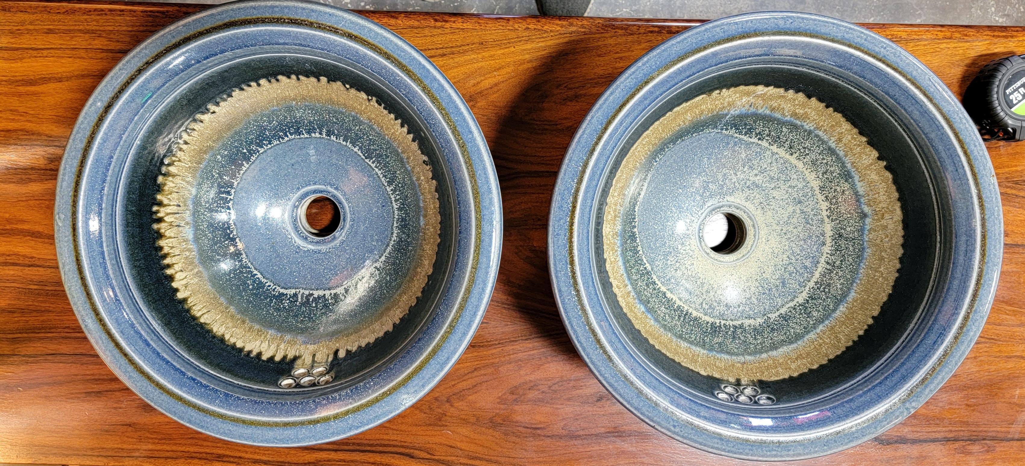 A mid-Century Modern / Scandinavian Modern ceramic sinks. 1970's. Glazed in variations of blue with drippy glaze detail. Incised with signature at base. 
