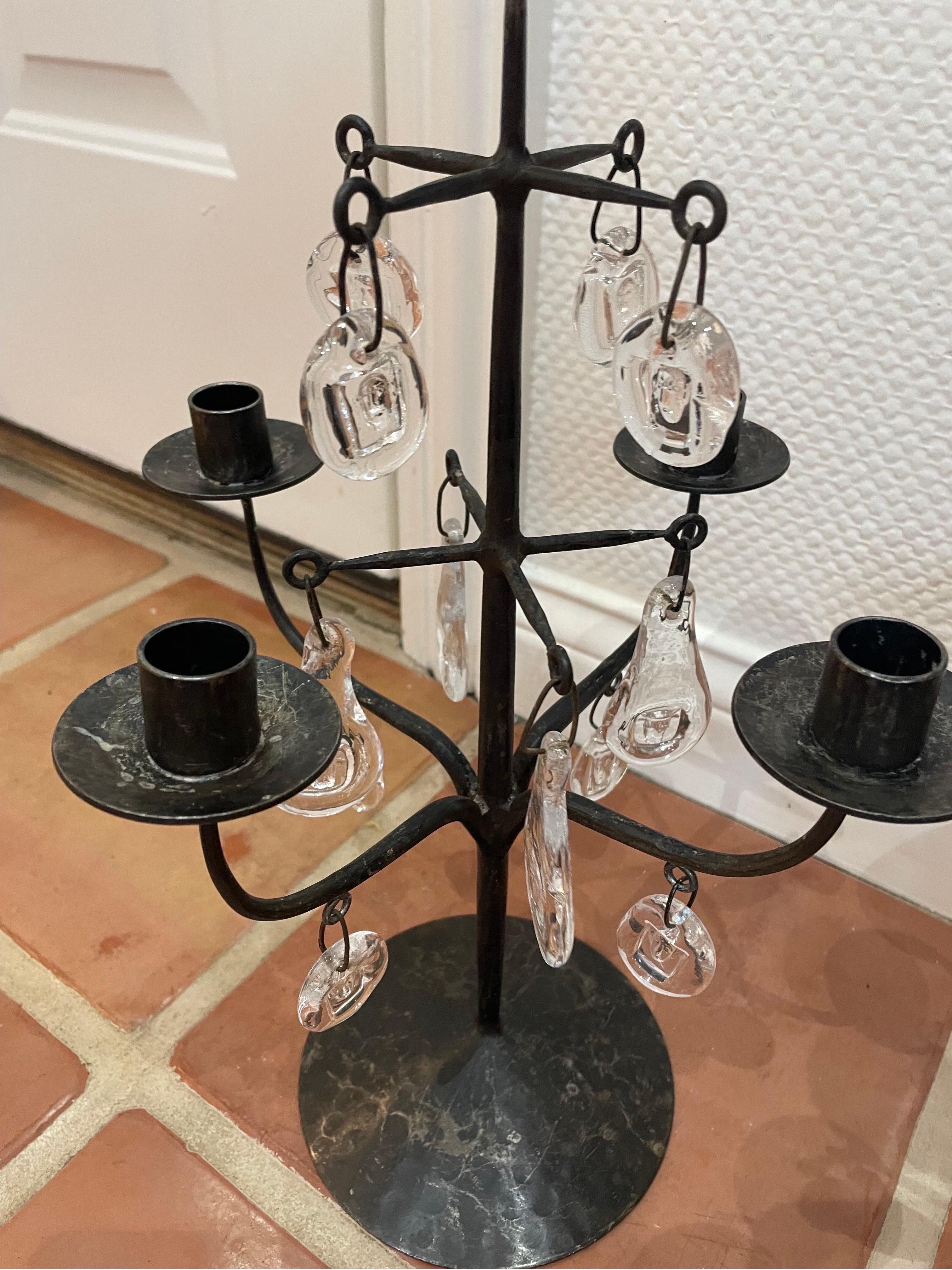 There are a pair of these metal and glass 5 arm candle holders. They are 1970s kosta boda candelabras by Erik Hoglund , in great vintage condition