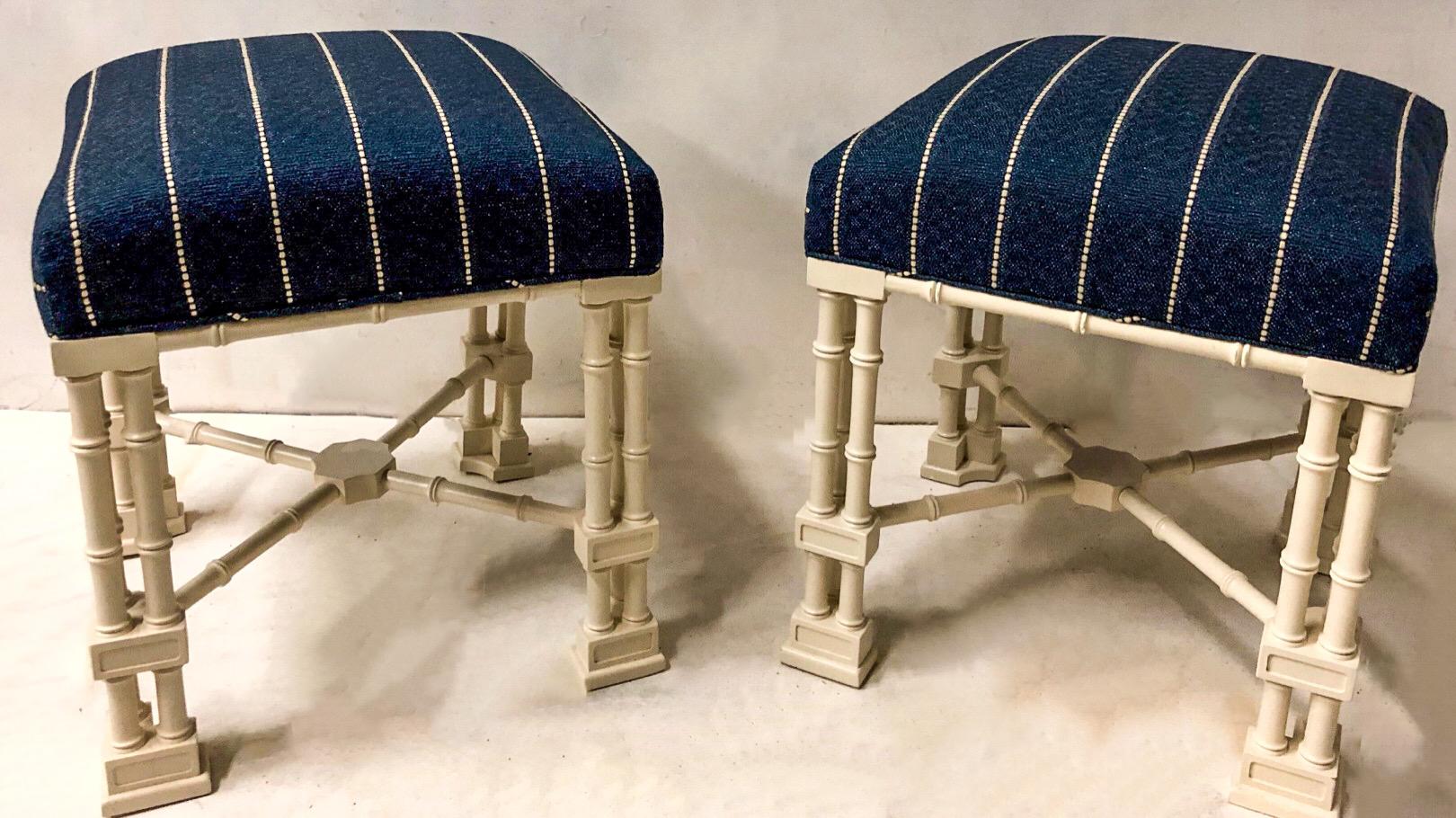 This is a vintage pair of Erwin Lambeth Chinese Chippendale style ottomans that have been newly upholstered in a textured linen. The finish is a satin linen white. They are marked.