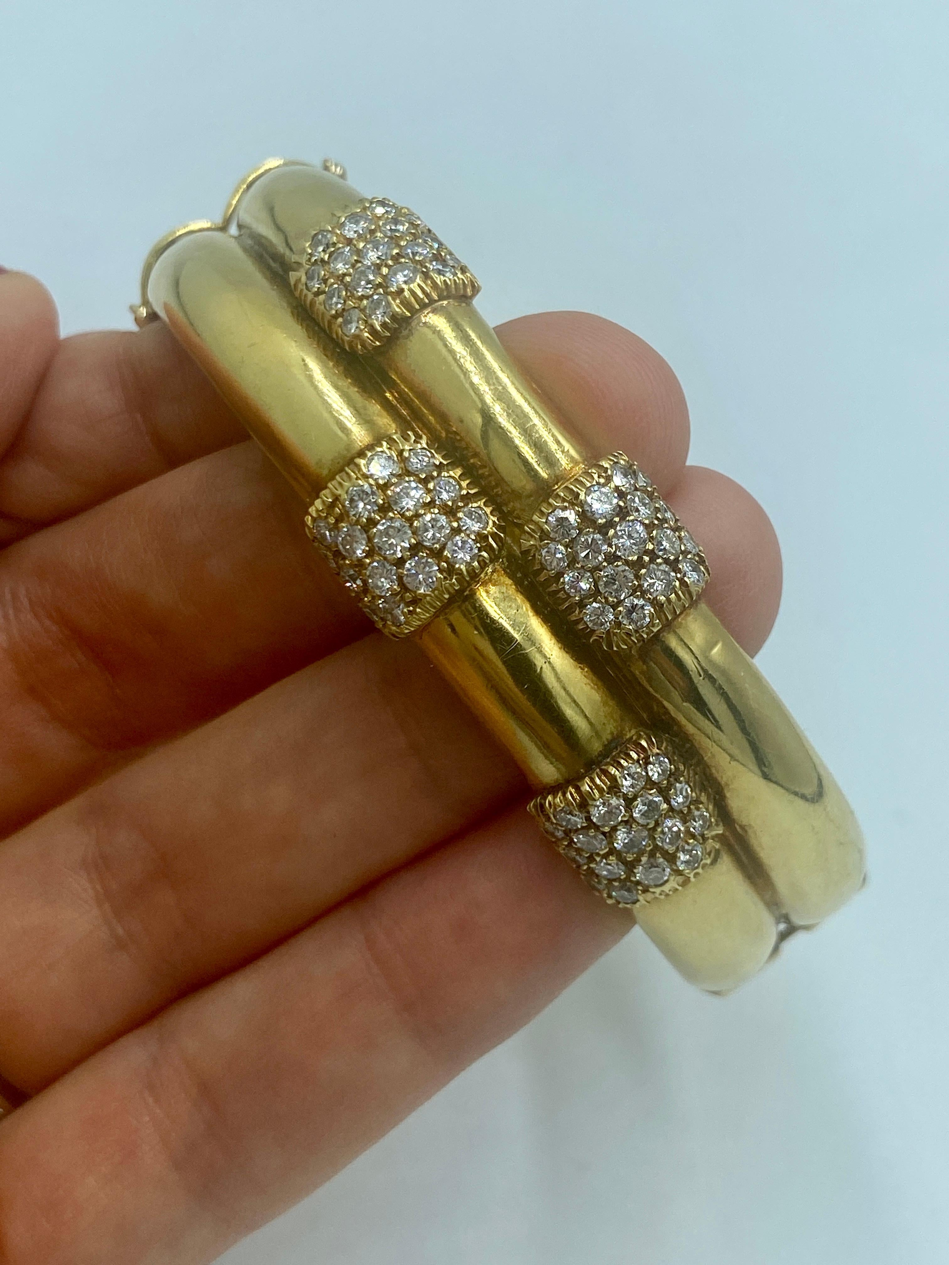 This 1970s European 18k gold bangle is in the shape of bamboo reeds adorned with approximately 2.7 carats of round cut diamonds. This beautifully made bracelet has an inner circumference of 18.5cm.