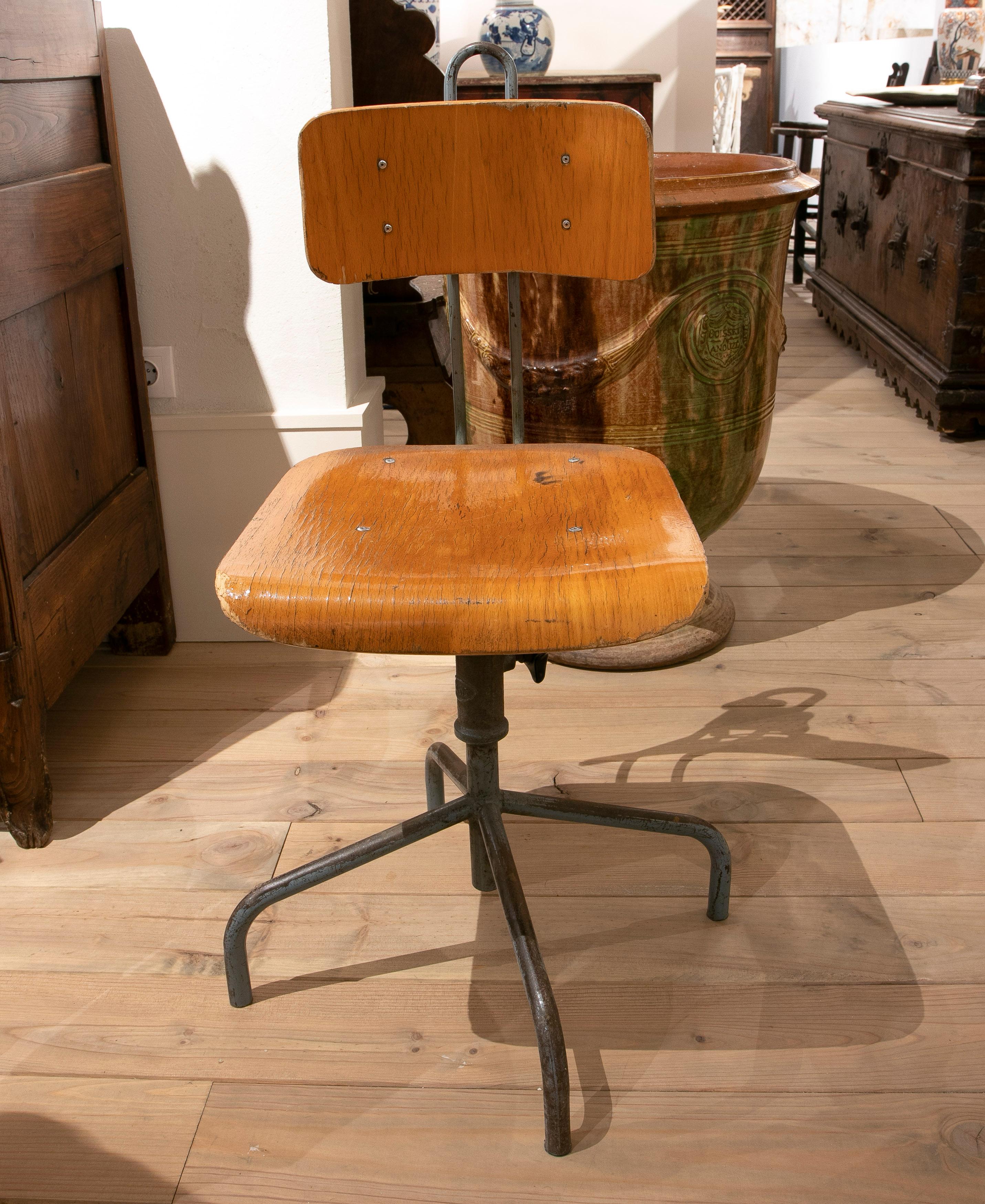 Vintage 1970s European wood and steel adjustable office chair.
