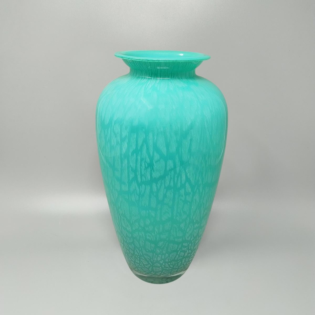1970s Exquisited handcrafted vase by V.A.M. in green crackle Murano crystal glass Made in Italy. The item is in excellent condition. This vase is beautiful and is signed at the bottom.
Dimension:
diam 5,11 x 15,74 H inches
diam 13 cm x 30 H cm