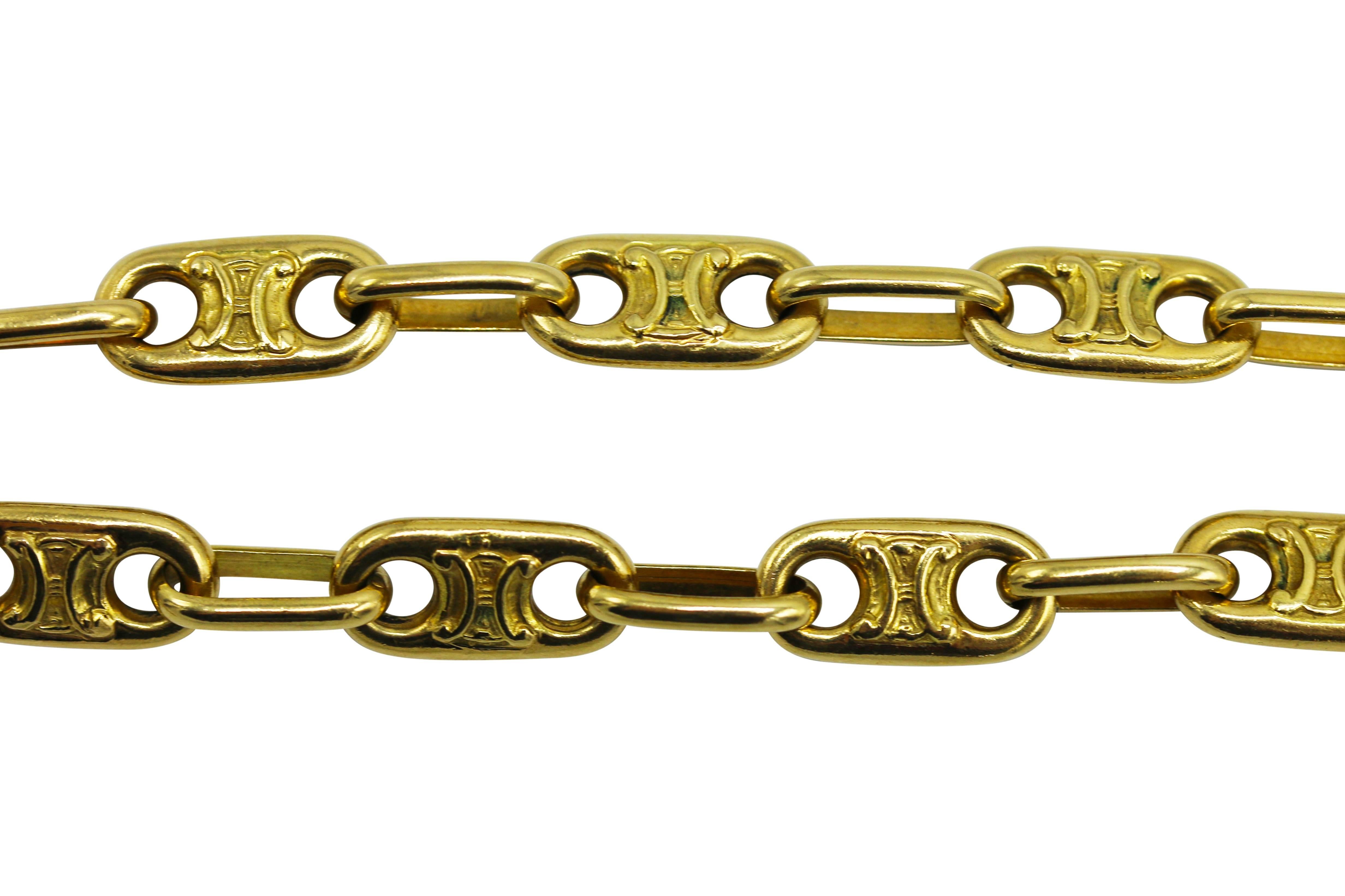 18 karat yellow gold fancy link long chain necklace, circa 1970, designed as a series of oval gold links with stylized H shape in the center in raised gold, gross weight 185.0 grams, length 42 inches, width 1/4 inch. 
A great addition to any jewelry