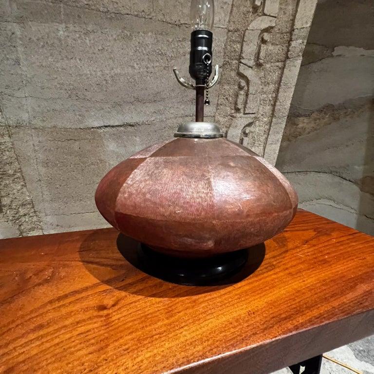 1970s Handmade Texturized Table Lamp Patinated Copper Mexico.
Style of Luis Barragan and Santa Clara de Cobre, Michoacan
Bent wood base painted black.
Brass hardware.
Lamp is fat oval shape.
19 T x 14.5 W x 11.5 D
Original Vintage Preowned