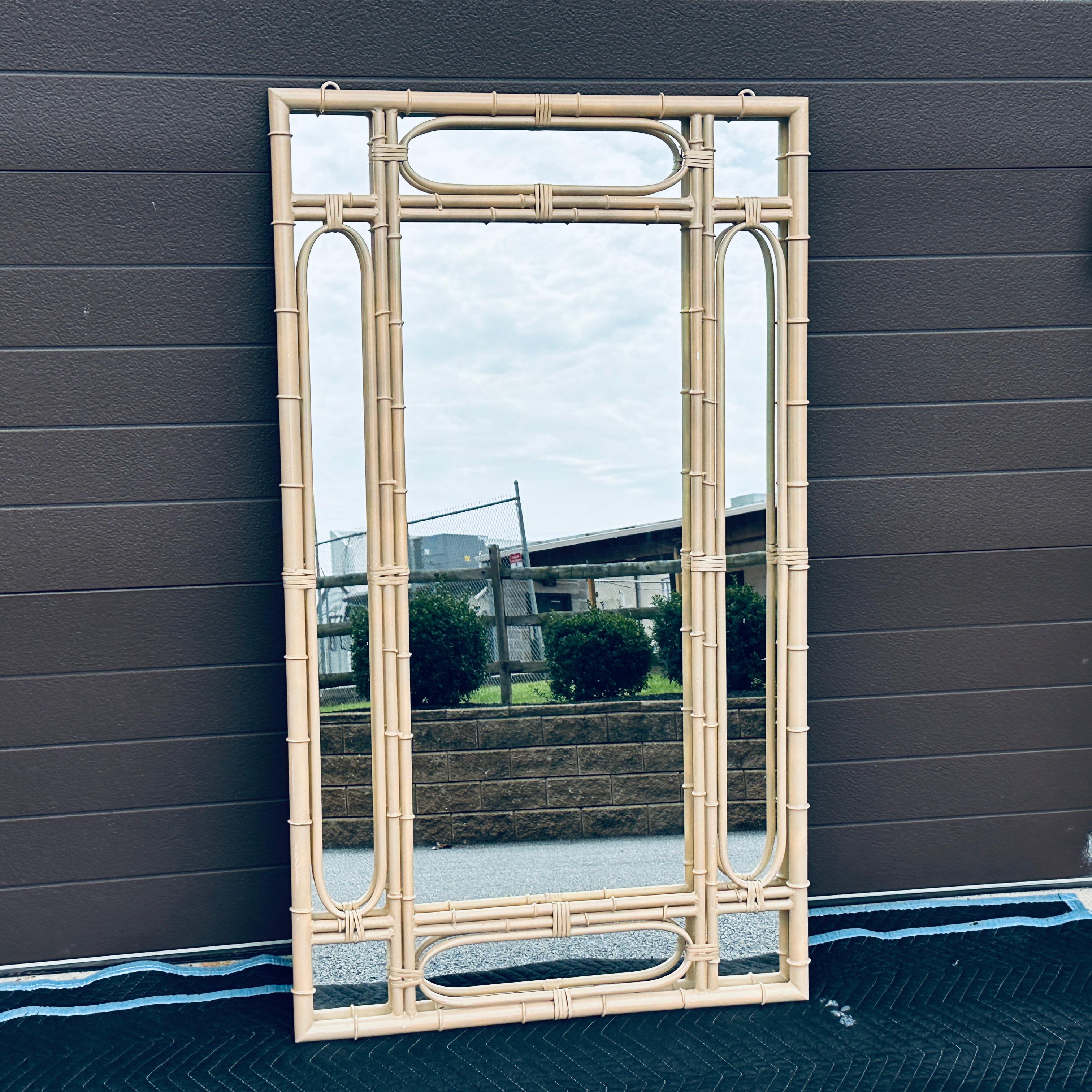 1970’s Faux Bamboo Metal Wall Mirror. The mirror can easily be removed to spray the frame any color.