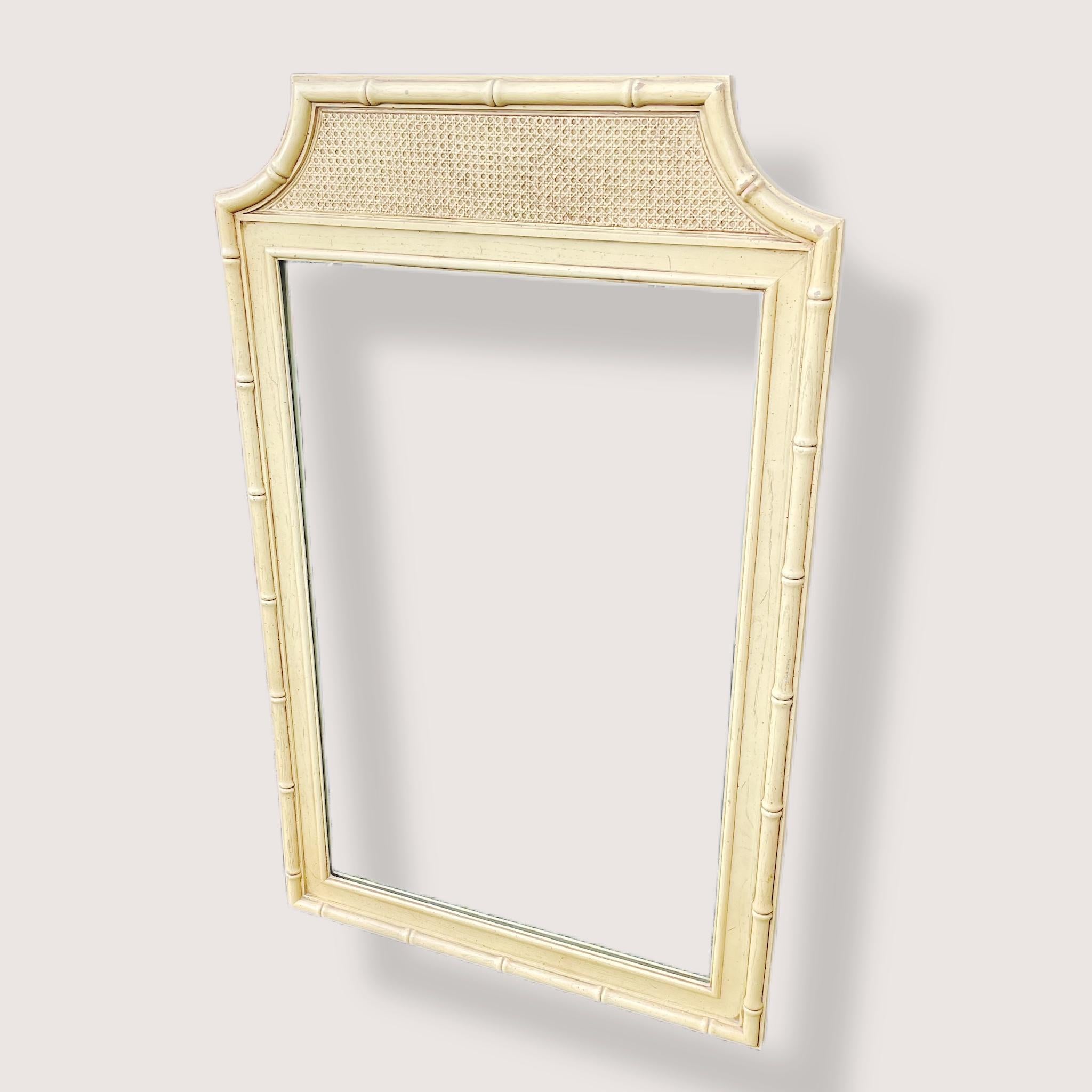 Here is a fun and stylish mirror that brings a tropical and organic element to the home with its faux bamboo and cane pagoda styled frame. It originally paired with a dresser, I believe by either Thomasville or Dixie, but has since divorced from