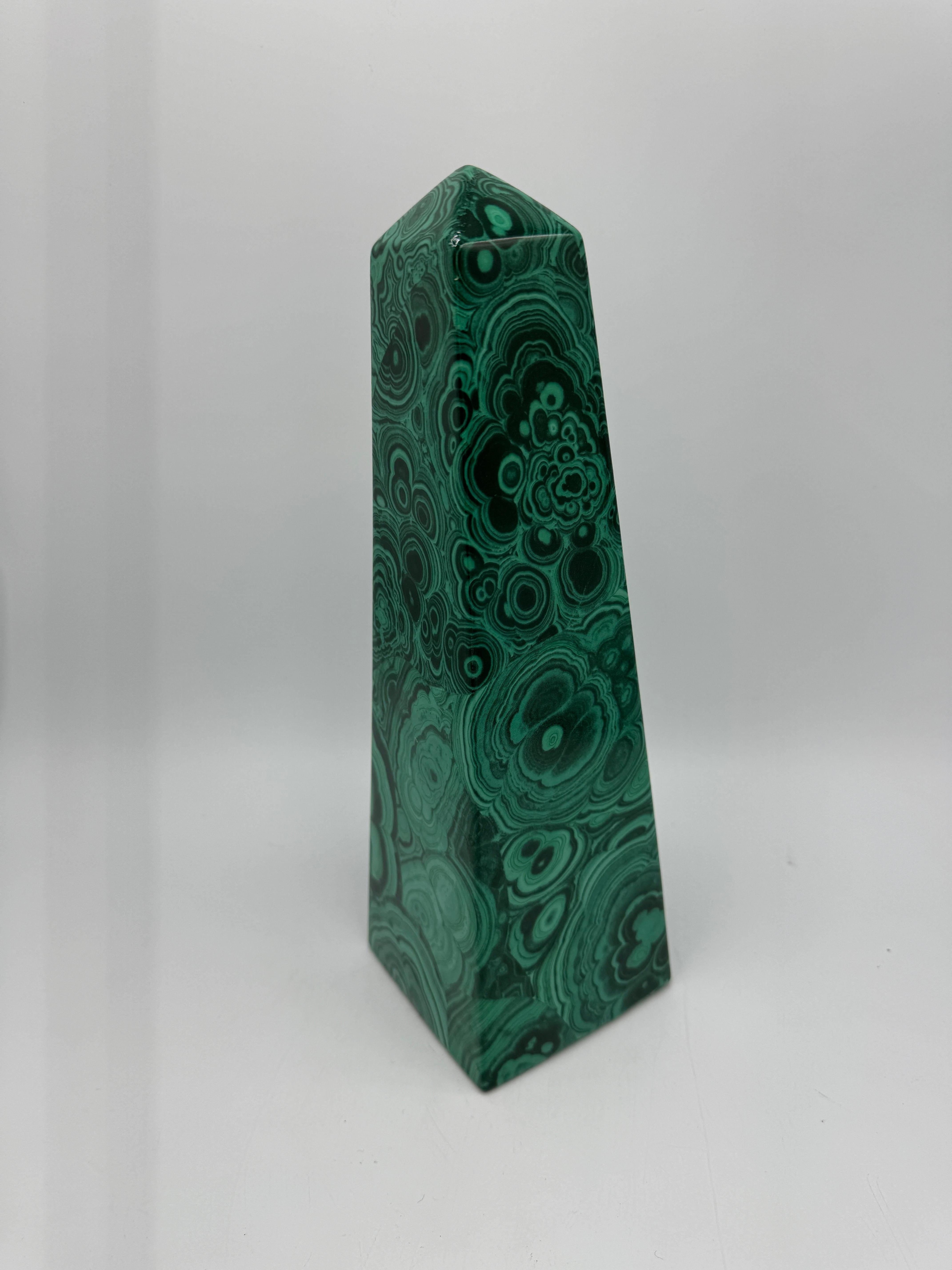 Offered is a fabulous, 1970s porcelain obelisk with a faux malachite design all over, attributed to Neiman Marcus' malachite design porcelain collection. Tall, standing just over 12in. Felt pads on underside. Hollow, but heavy - weighing 1.10lbs.