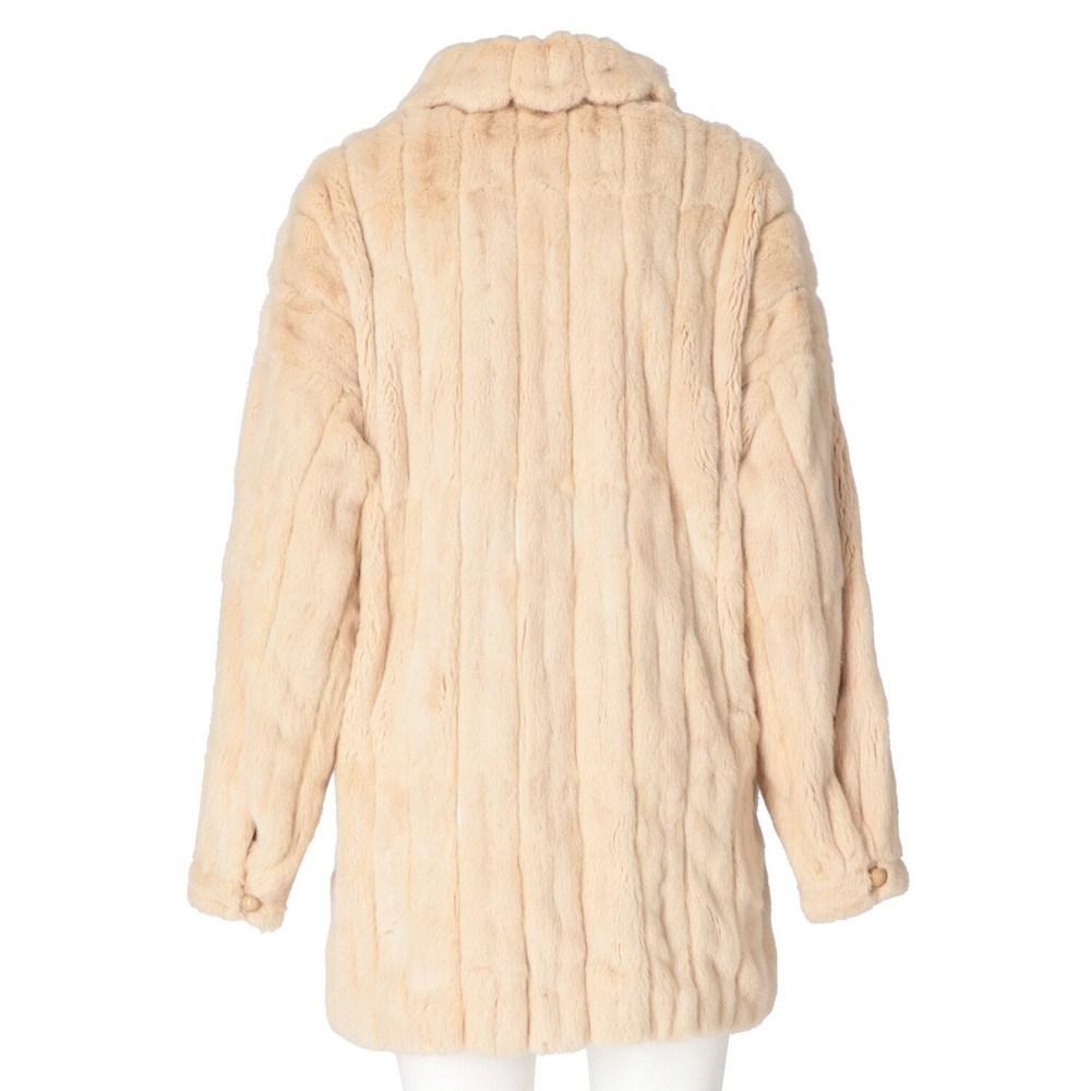 Fendi ivory ermine fur coat. Classic collar, front closure with snap buttons. Long sleeves, welt pockets and patch pocket on the chest.

Size: 42 IT 

Flat measurements
Height: 76 cm
Bust: 58 cm
Shoulders: 40 cm
Sleeves: 60 cm

Notes: Please note,