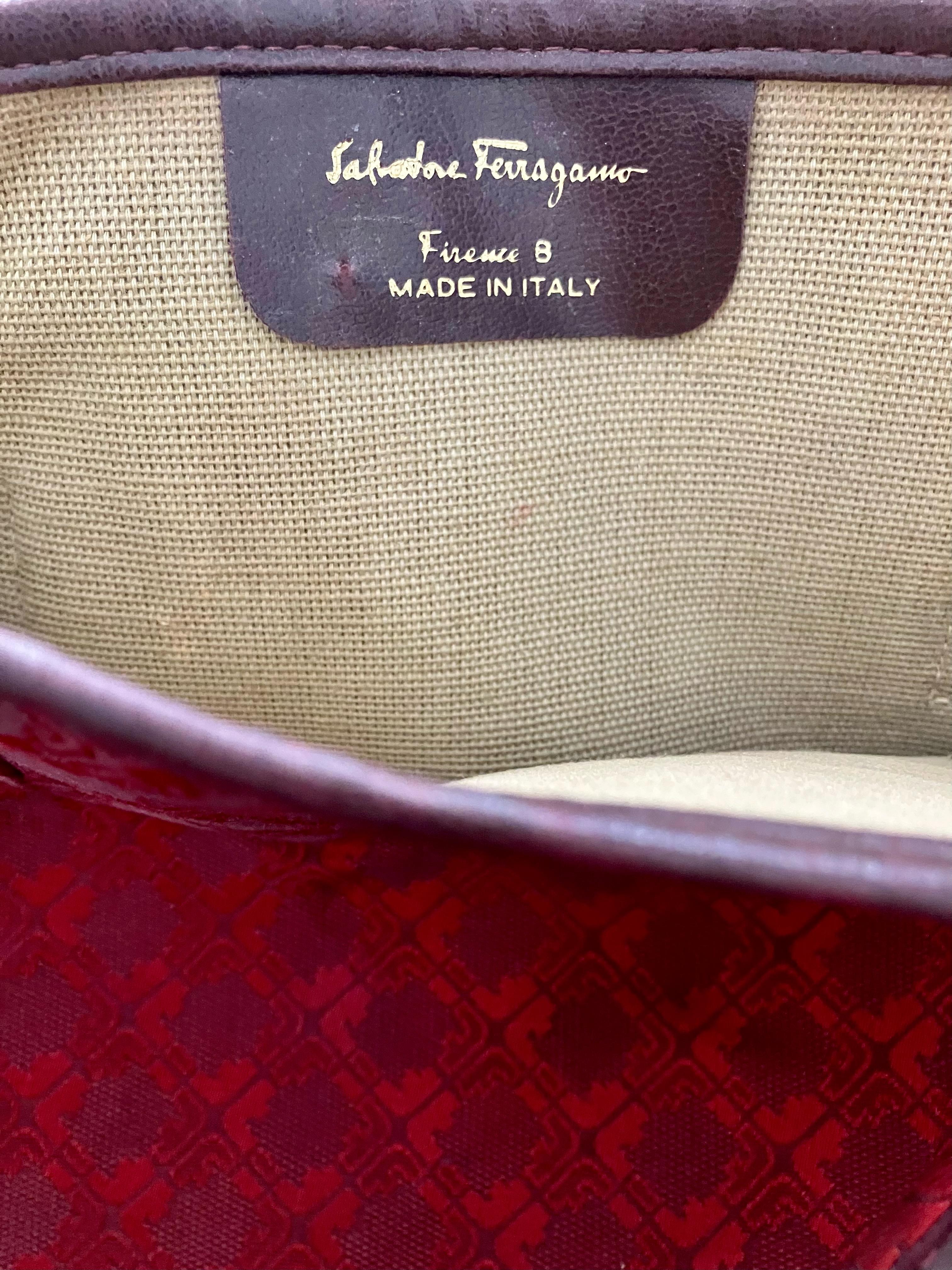 1970s Ferragamo burgundy tote bag featuring an all-over canvas pattern, burgundy leather finishing, top handles, inside camel cotton canvas, inside logo leather brand  stamp label.  
Circa 1970s
Made in Italy (Firenze 8)
In good vintage