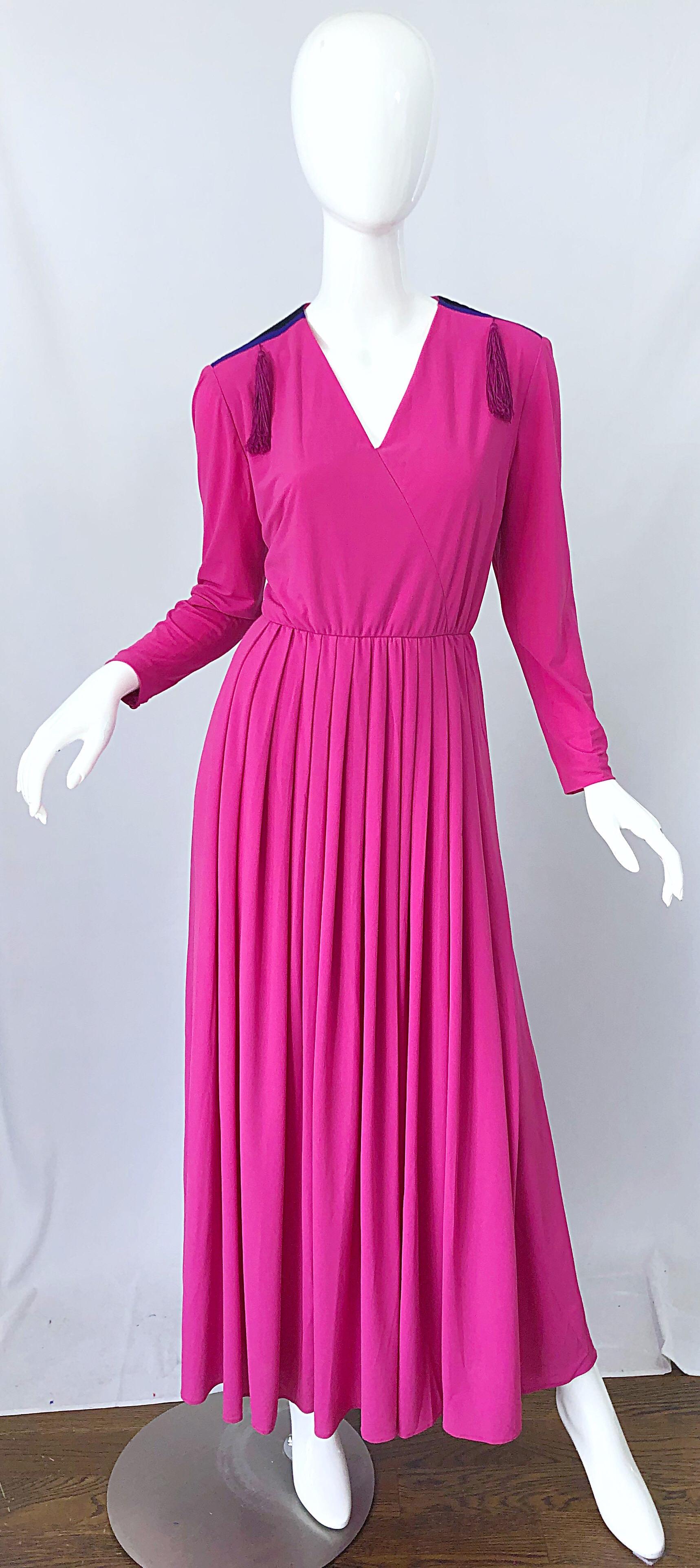 Beautiful 1970s dress by French design house FINK MODELL! Beautiful vibrant hot pink color with purple and black stripes on the shoulders. Tassels at each shoulder add just the right amount of pizazz. Soft rayon jersey offers lots of stretch.