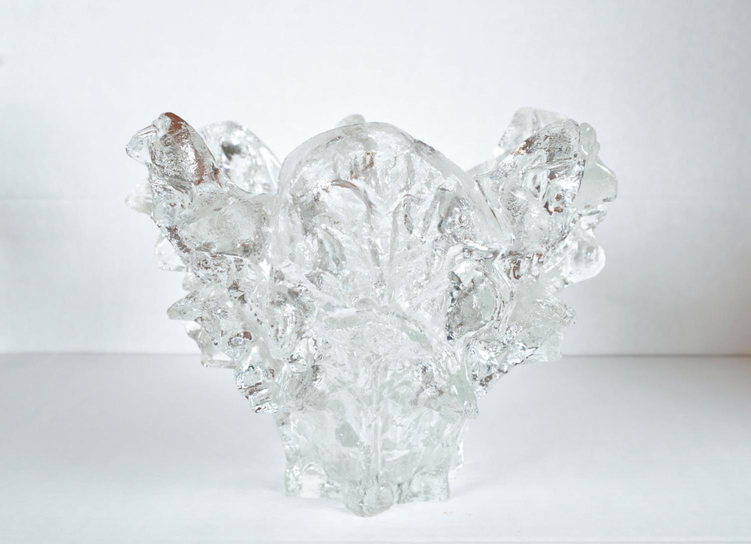 This heavy and sturdy thick piece of clear Finnish glass - known as ‘Iceberg’ - was designed by Pertti Santalahti for Humppila Finland. It has the most stunning formation of textured ice glass, which shimmers and sparkles. 
I have seen examples with