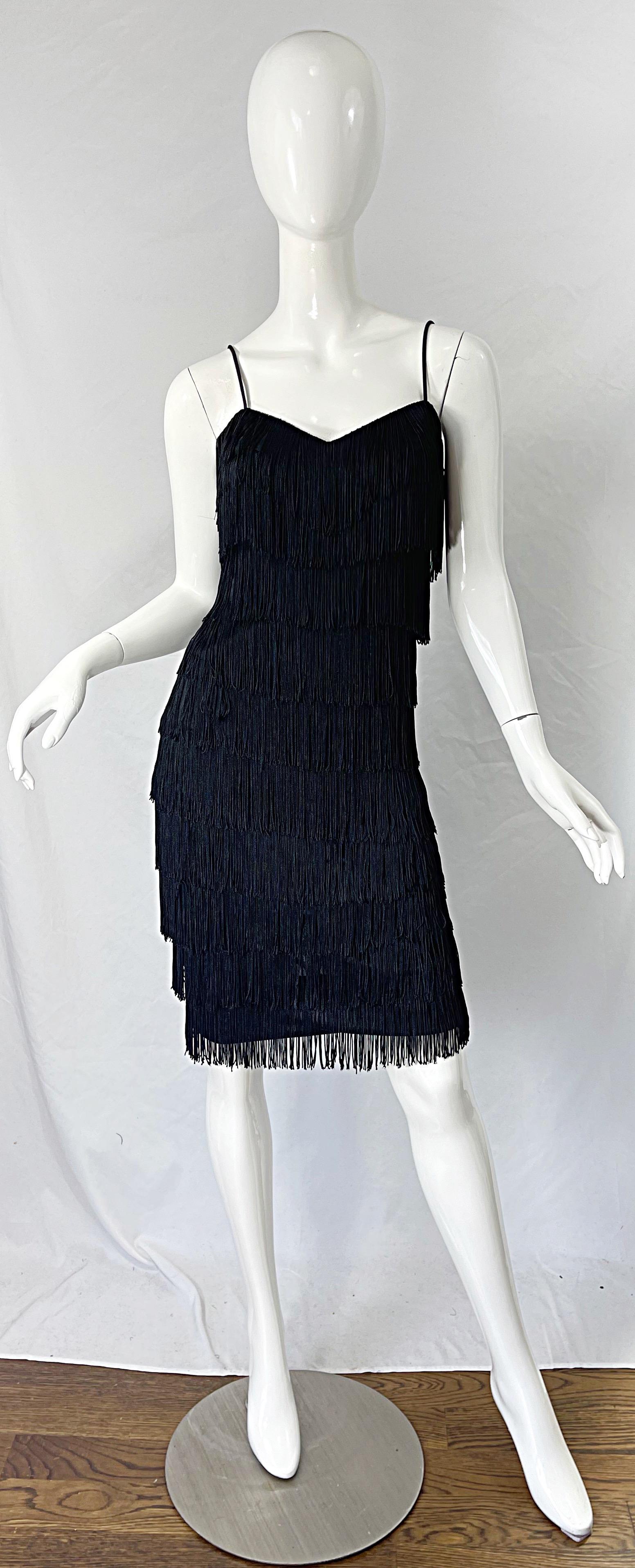 Channel your innner Studio 54 in this black fully fringed flapper style disco dress ! Features allover fringe that looks fantastic with movement-- would look phenomenal on the dance floor ! Hidden zipper up the back. Soft stretch jersey fabric. Very