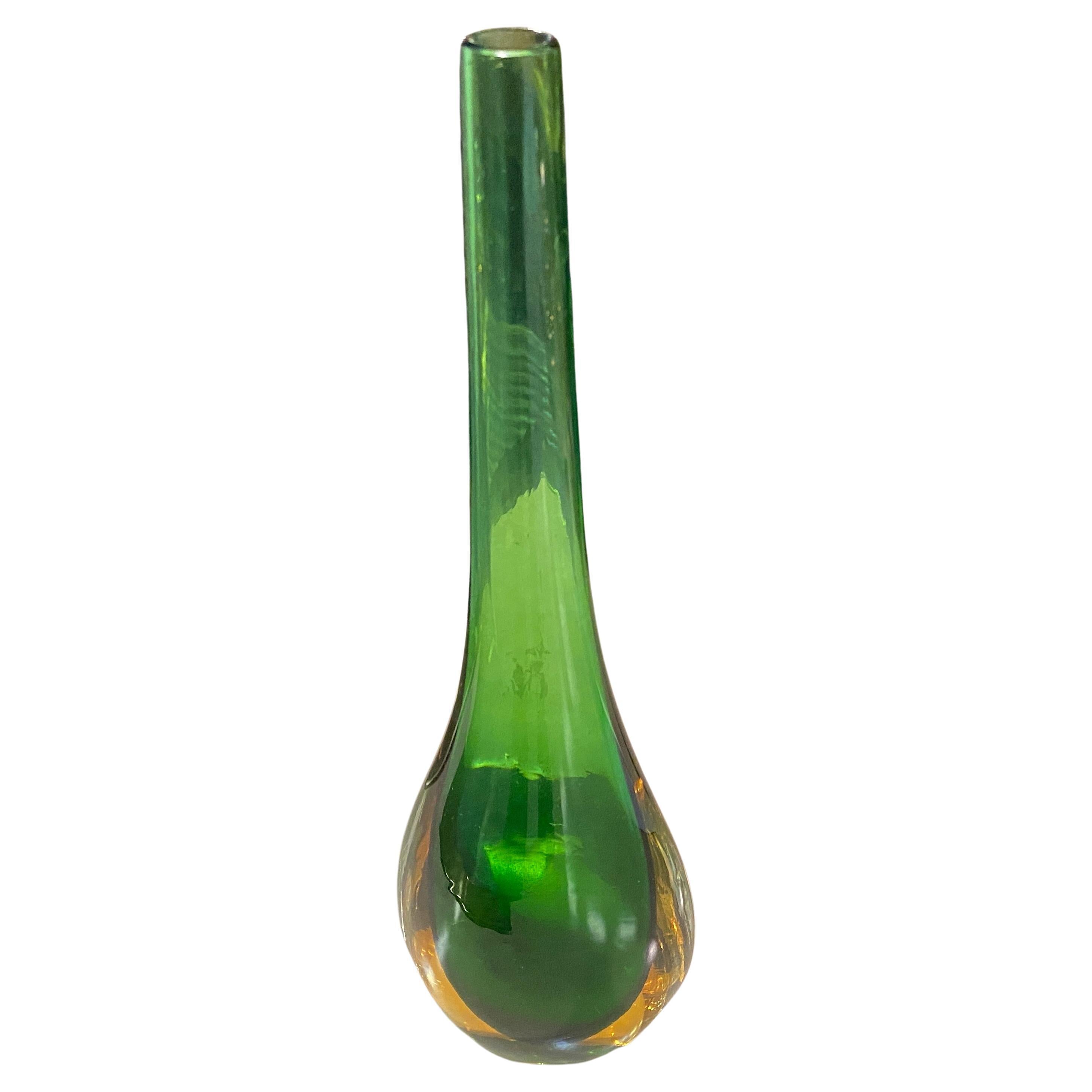 A lovely green and yellow murano glass single flower vase designed and manufactured in Milano in the manner of Flavio Poli. The Sommerso murano glass vase it's in perfect conditions. Sommerso technique It's the decorative technique which, starting
