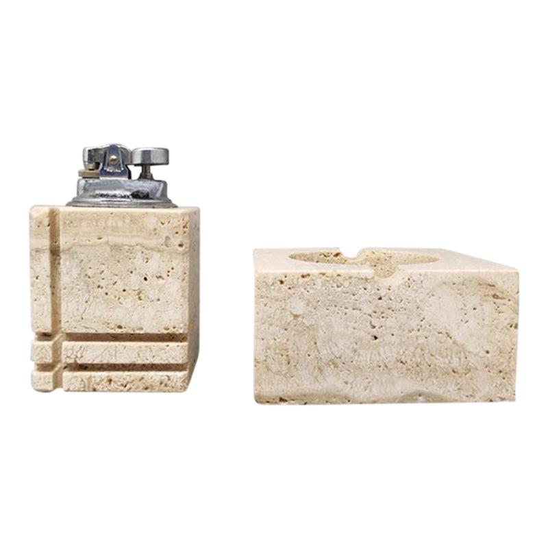 1970s Gorgeous smoking set by Enzo Mari for F.lli Mannelli in travertine with ashtray and table lighter, everything is handmade carved. Made in Italy. The table lighter works. This smoking set is in excellent condition.
Dimension :
Table