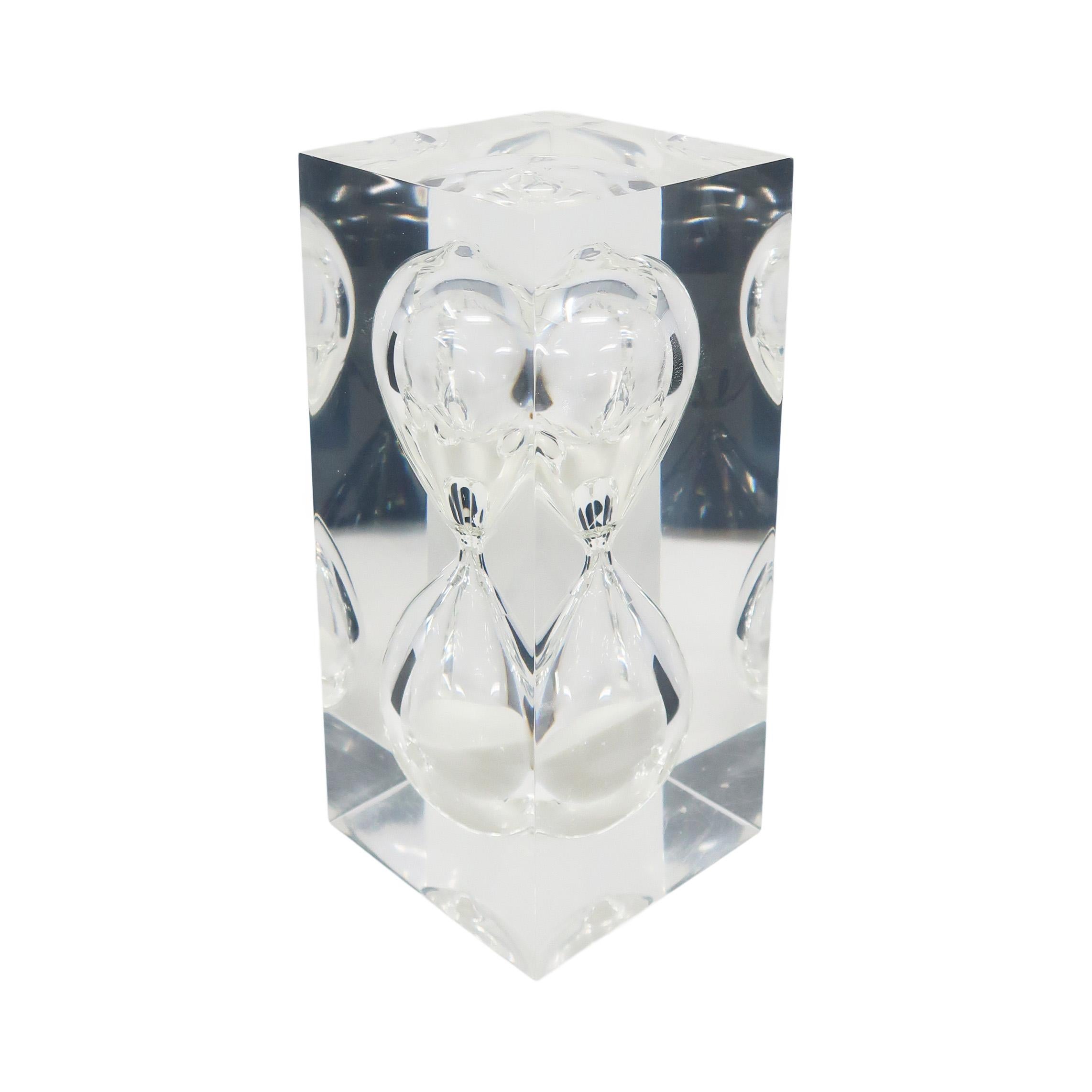A striking and whimsical late mid-century sculpture, paperweight and crowd-pleasing decor item, this piece is attributed to Pierre Giraudon, an artist and designer known for suspending items in lucite in his designs. For this Pop Art piece, an