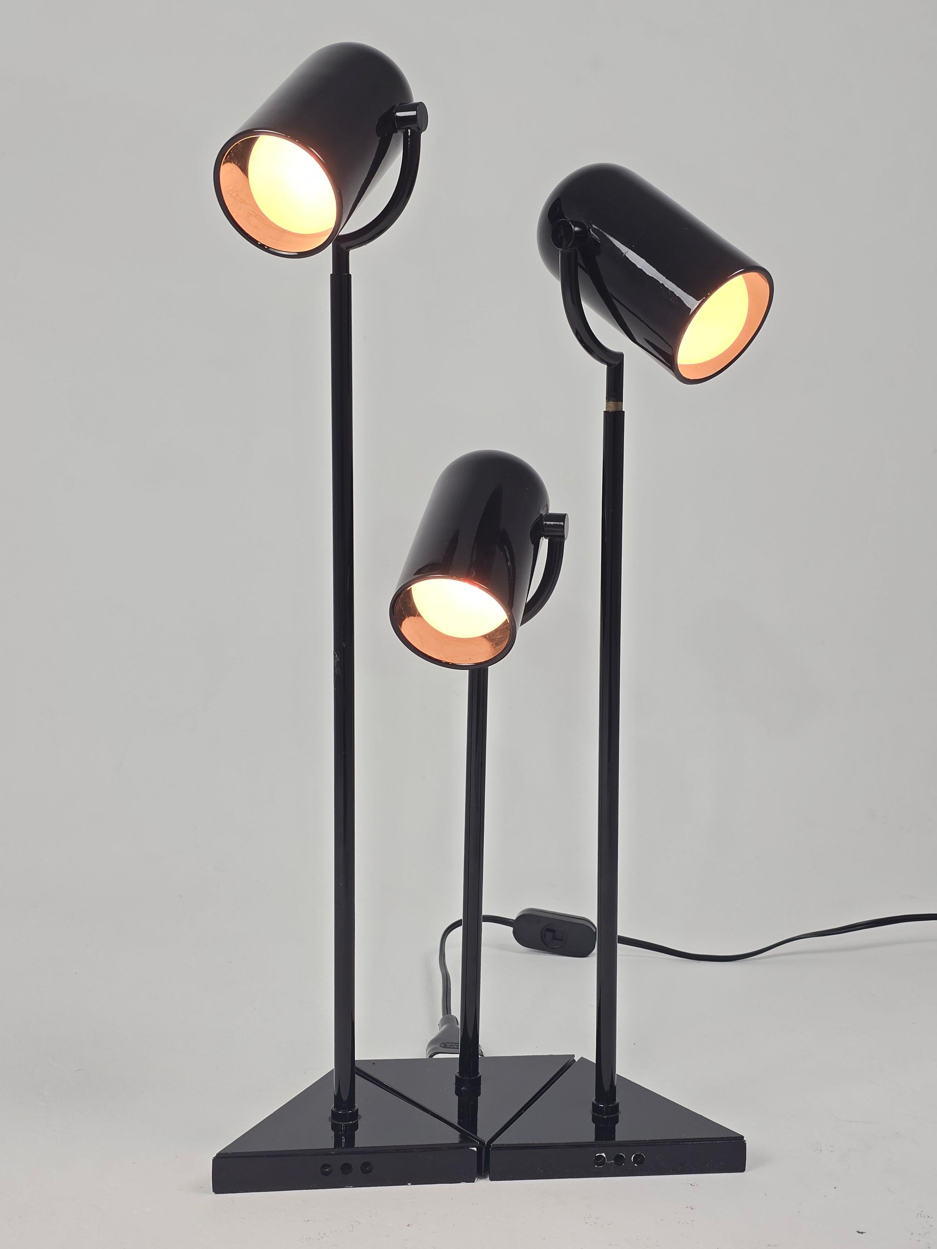Rare Florence Casey 3 pivotal heads in high gloss black table lamp .

Prime quality material , detail and finish . Well made solid construction . 

Pivot in all direction in a circular motion and fully up and down . 

Each triagular base