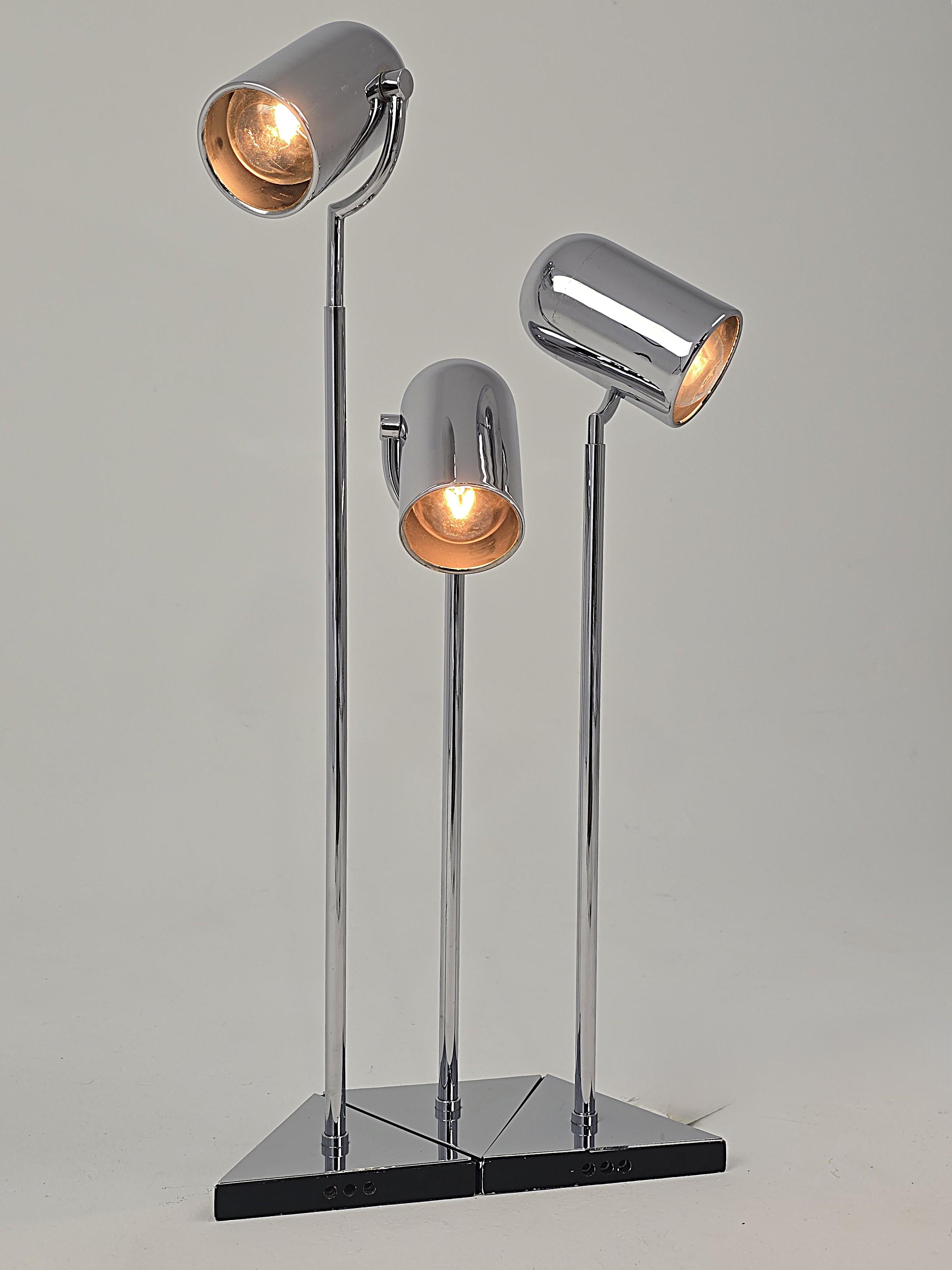 Rare Florence Casey 3 pivotal heads chrome table lamp .

Prime quality material , detail and finish . Well made solid construction . 

Pivot in all direction in a circular motion and fully up and down . 

Each triagular base interconnect with the