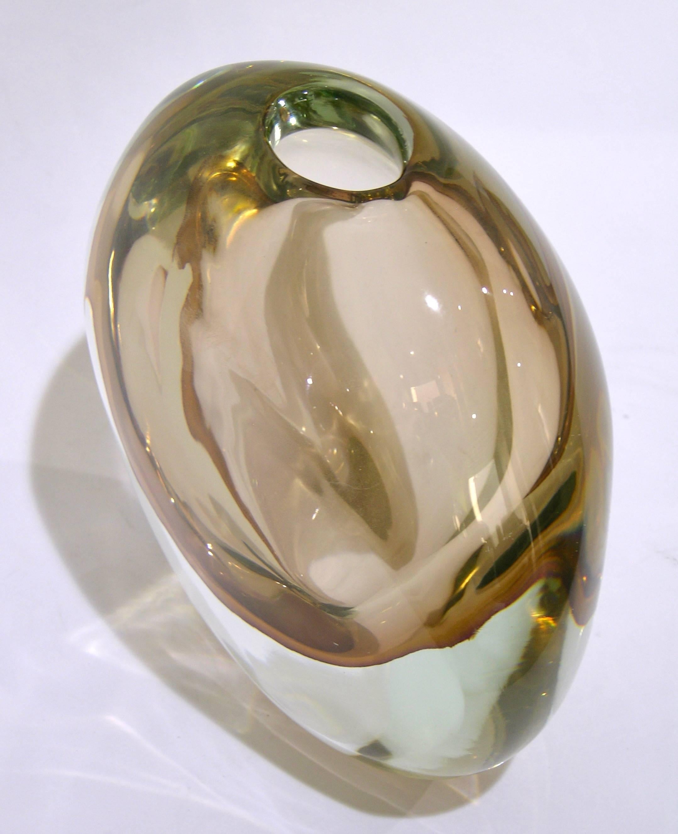 Signed Formia Murano, a sophisticated vase with Art Deco flair in blown Murano glass of rare color, a smoked pink champagne rose´ worked in sommerso, overlaid in crystal clear Murano glass. The organic minimalist ovoid shape of the piece adds to its
