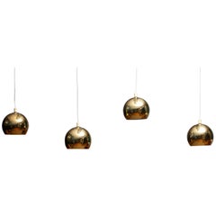 1970s, Four Brass Spherical or Globe Shape Swedish Pendants