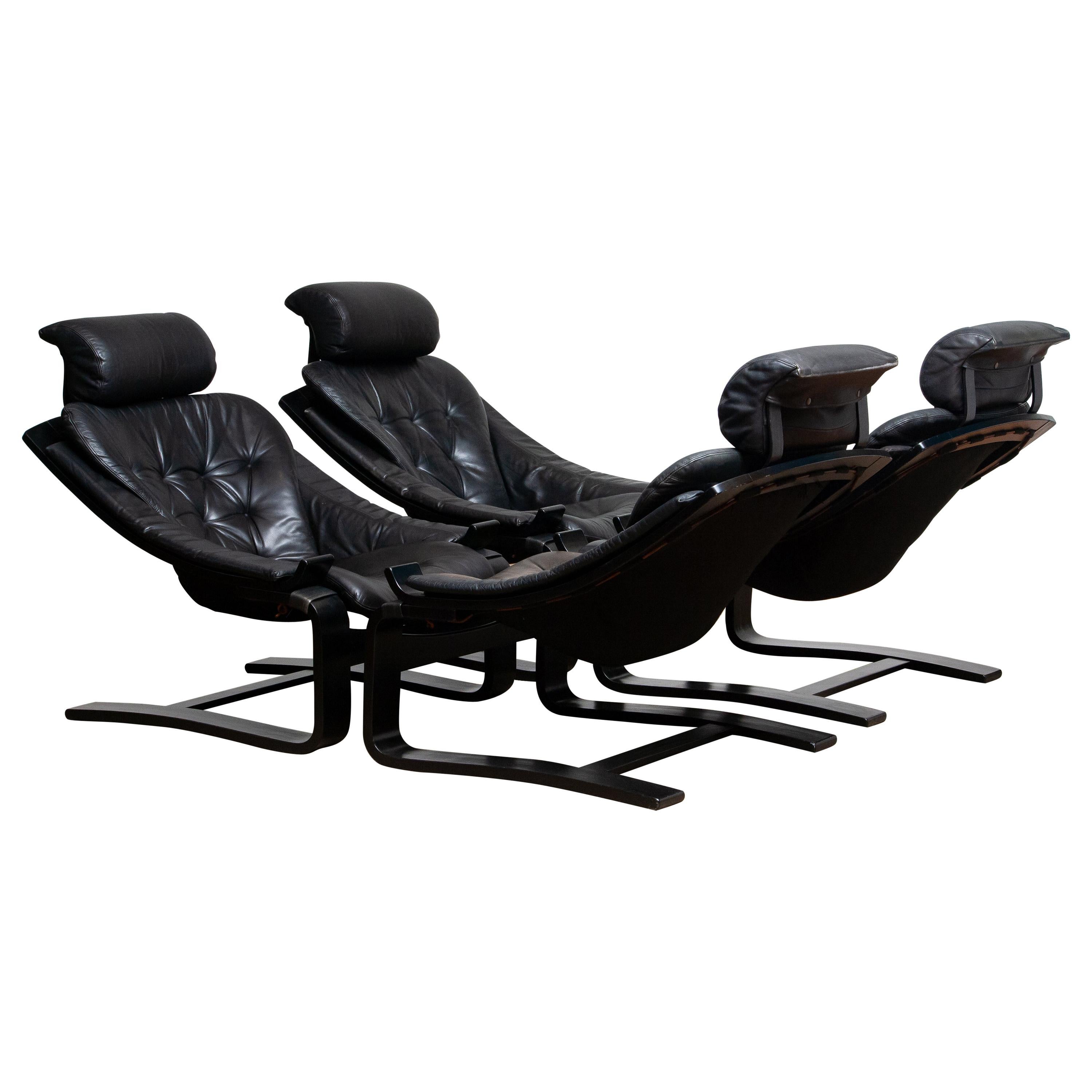 Set of four extremely comfortable black lounge / easy chairs, model 