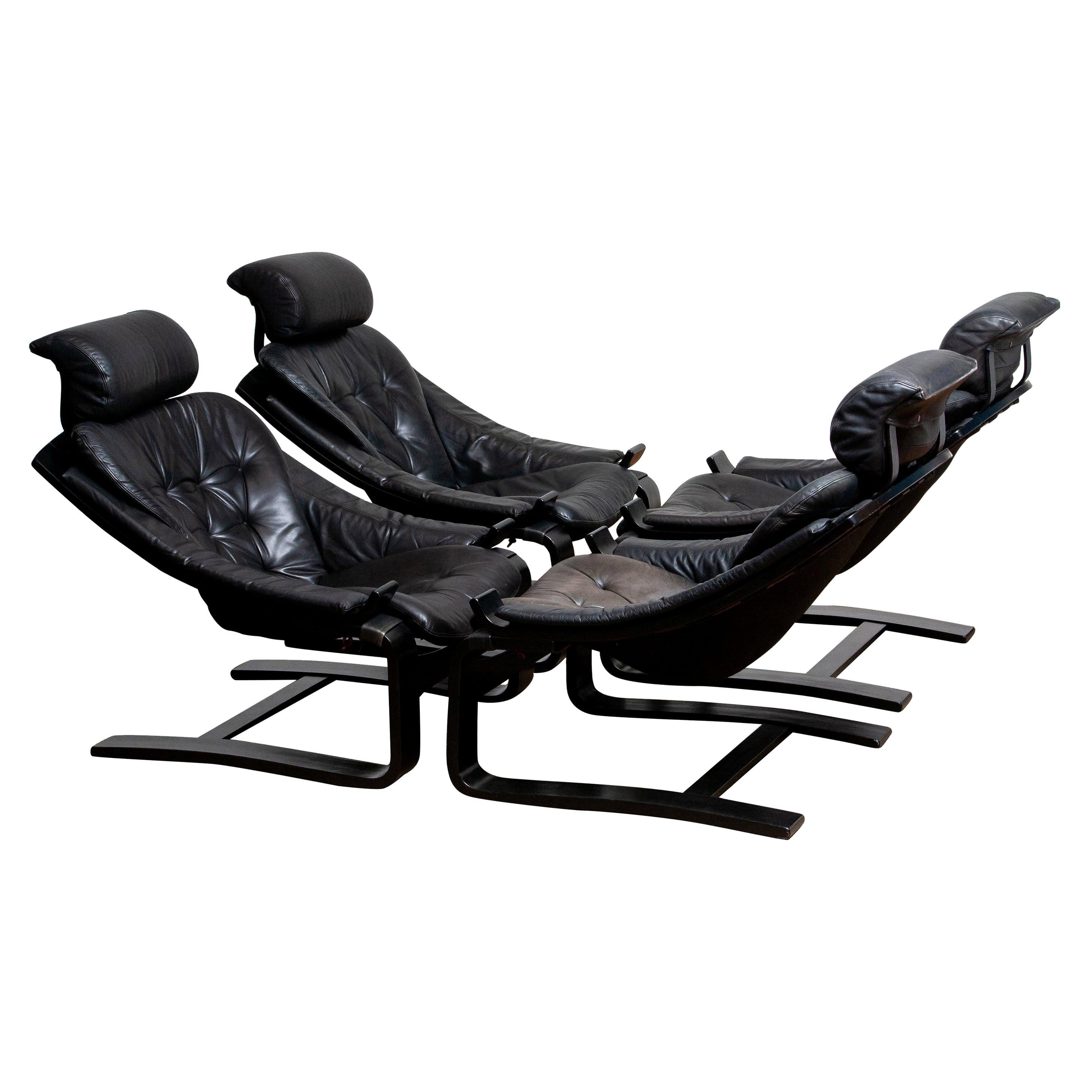 Set of four extremely comfortable black lounge / easy chairs, model 