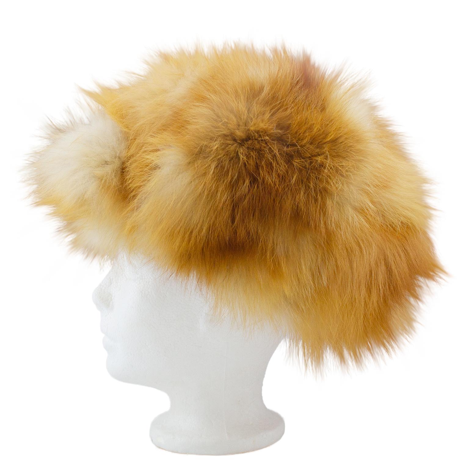 1970s toffee and white fox fur Ushanka hat. Gold satin quilted interior. Ear flaps can be tie and worn up. Excellent vintage condition. Made in Finland. 20