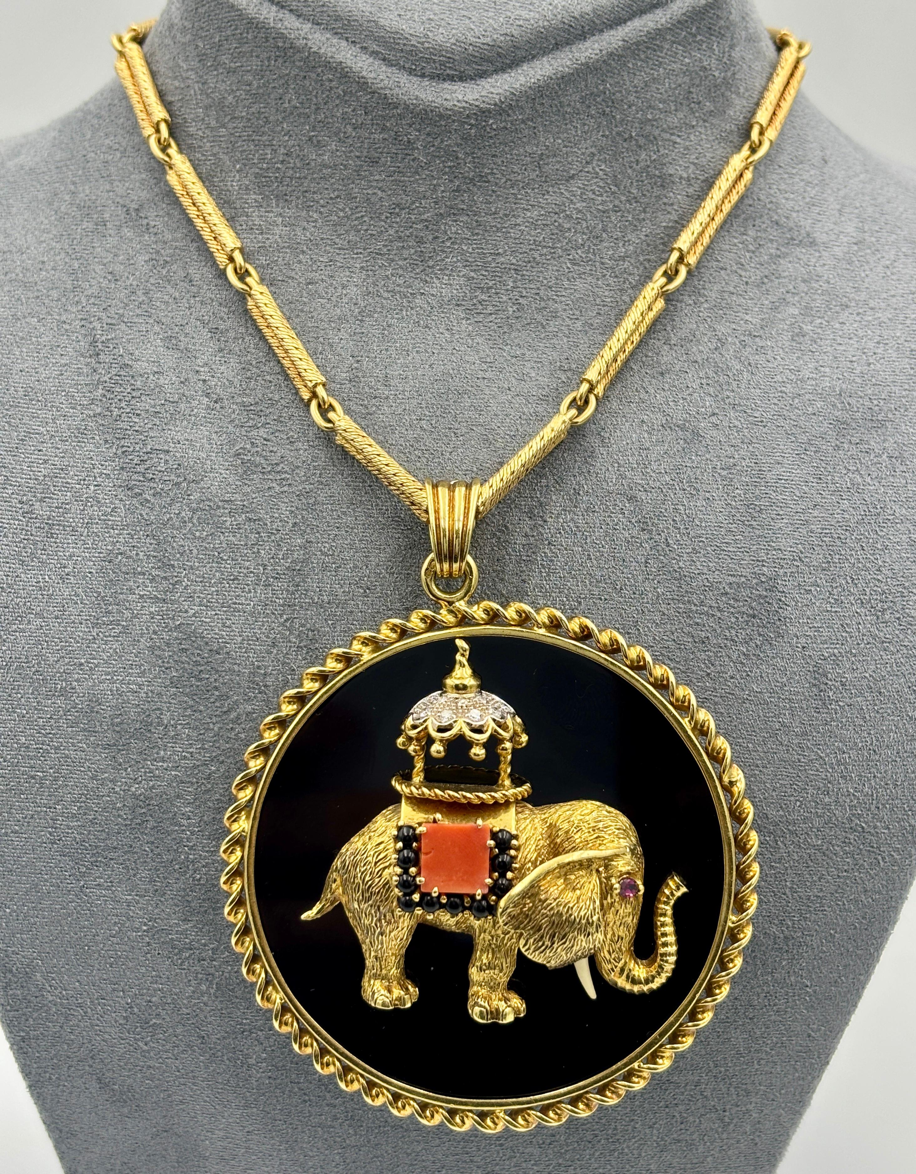 This delightful 1970s sautoire by Fred Paris consists of a beautifully delicate, completely hand made chain that measures 70cm. The medallion pendant is made of onyx with the figure of a charming 18k gold elephant embellished with coral and diamonds